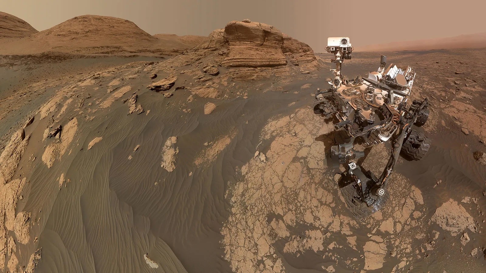 NASA’s Curiosity Mars rover used two cameras to create this selfie in front of Mont Mercou in the Red Planet’s Gale Crater. The rover tracks the planet’s weather