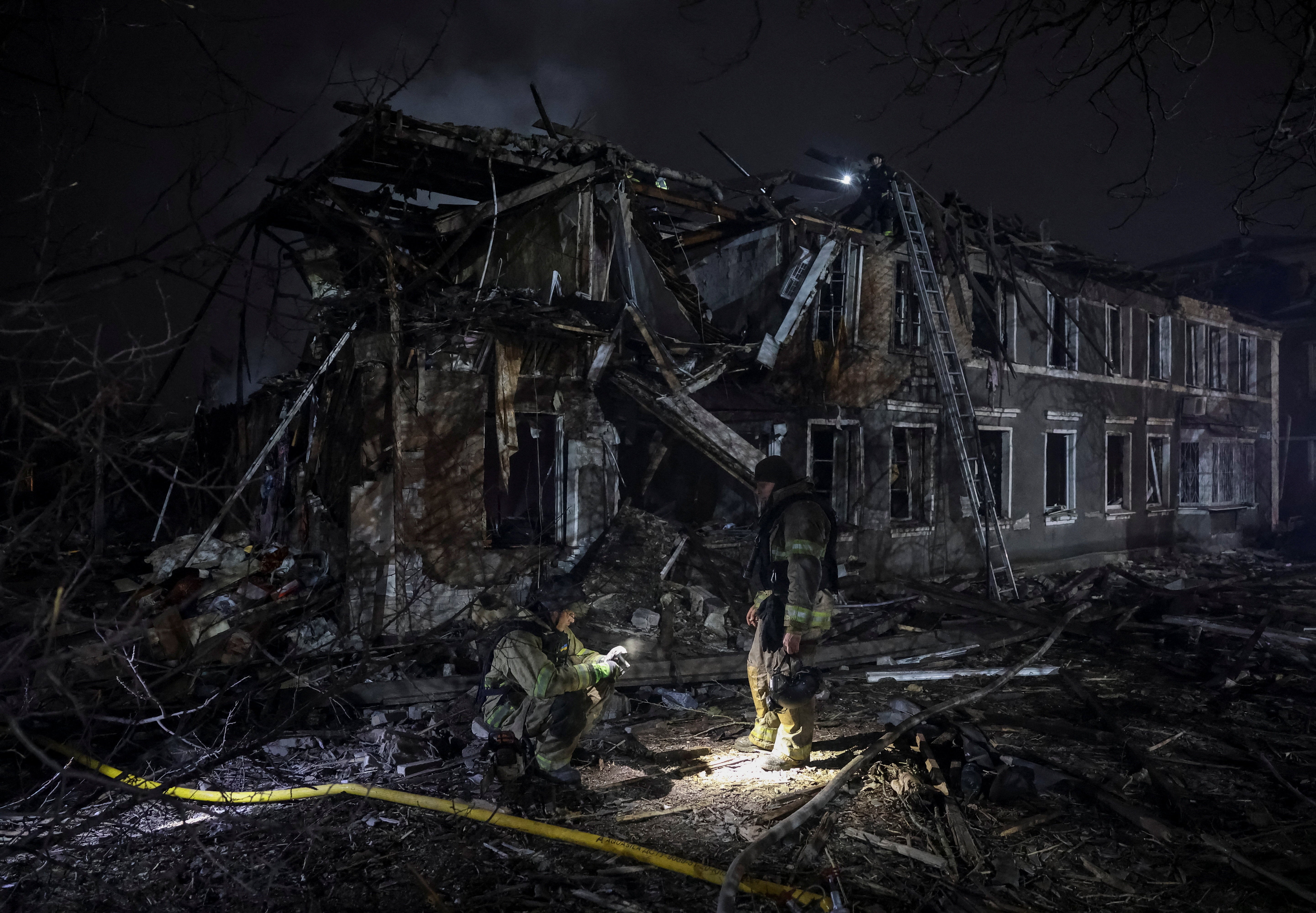 Rescuers work at the site of a destroyed building in Sloviansk, Ukraine