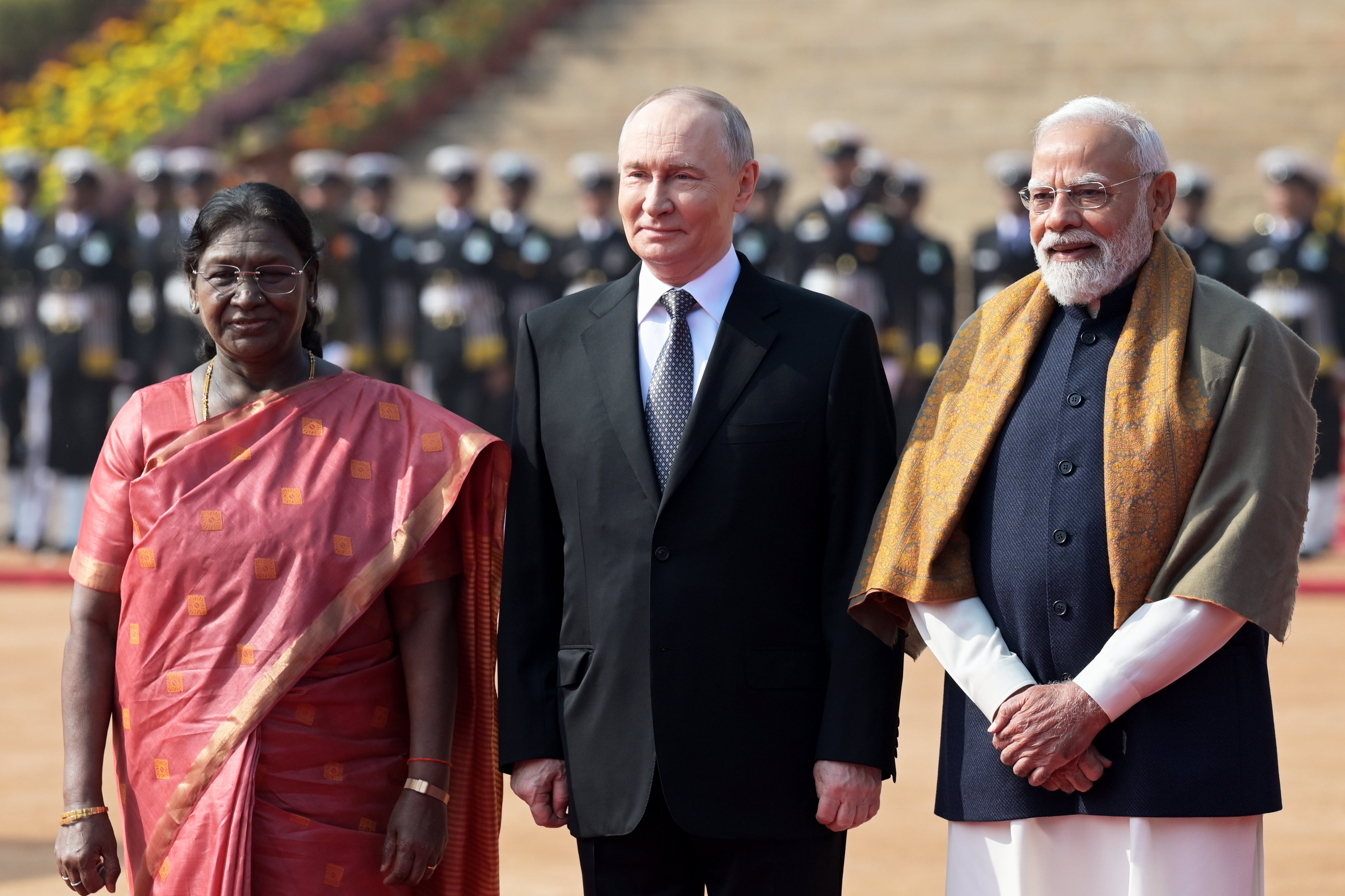 Vladimir Putin with Indian president Droupadi Murmu (L) and prime minister Narendra Modi at the presidential palace in New Delhi