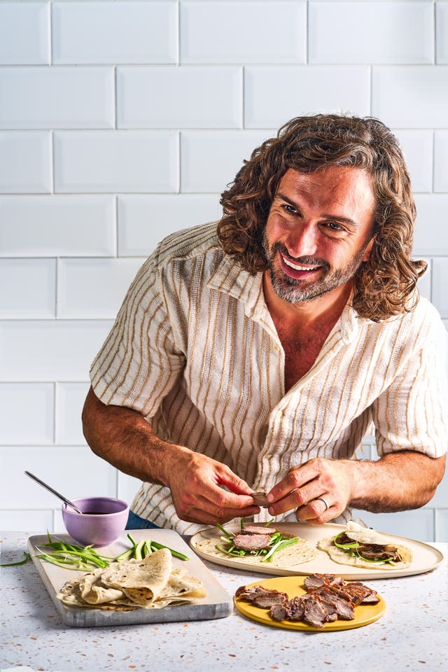 <p>The Body Coach in his natural habitat: proving that feeding a family well starts with actually lighting the hob</p>