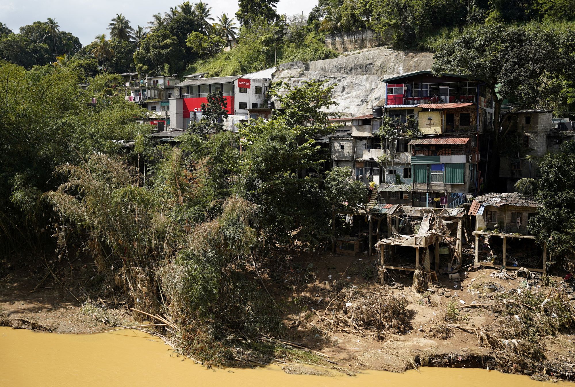 Houses damaged by the overflowing Mahaweli River following Cyclone Ditwah, in Kandy, Sri Lanka