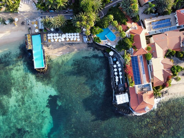 <p>Odjo D’Agua Hotel’s defining feature is its infinity pool that extends over the crystal clear ocean</p>