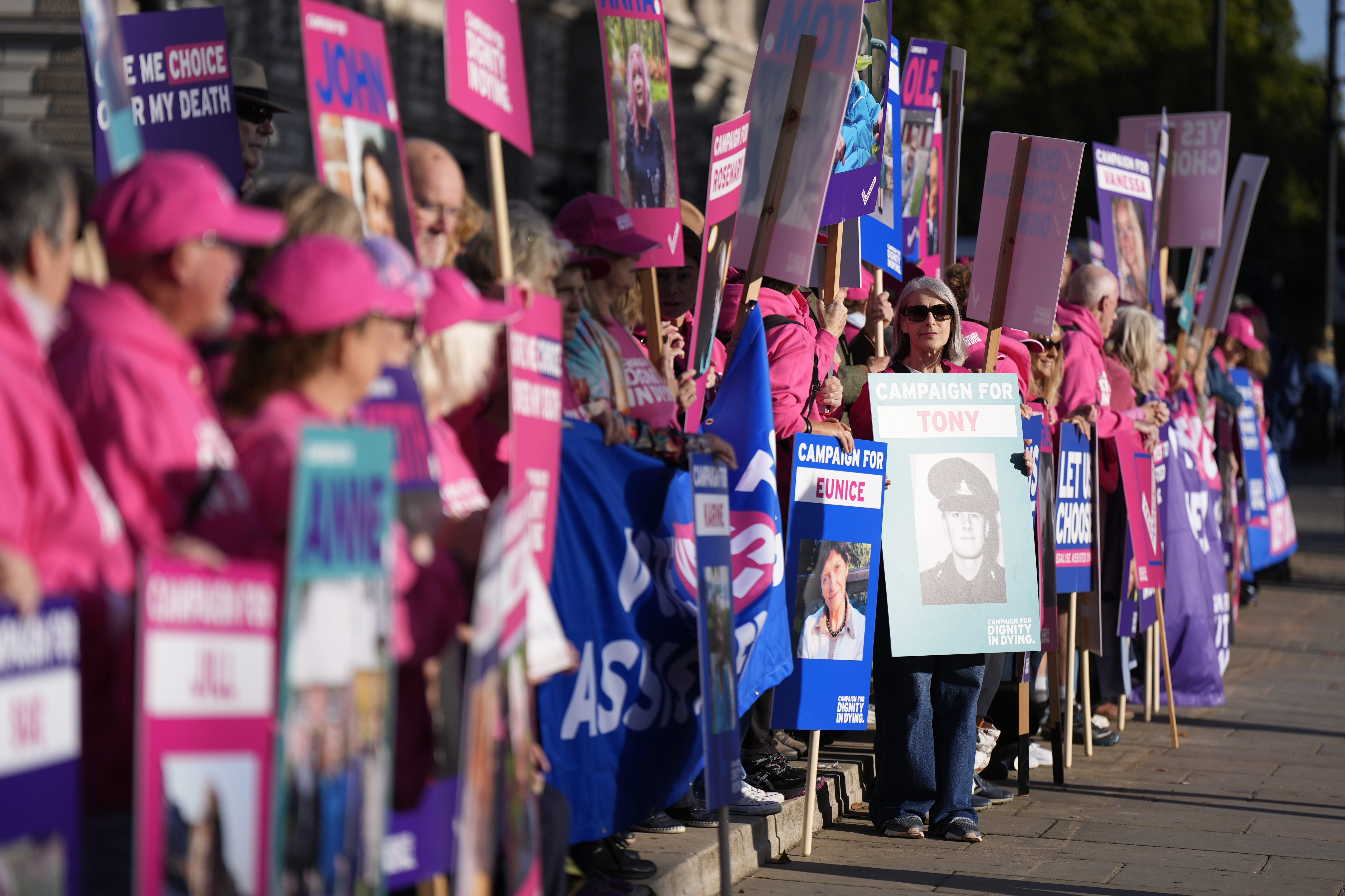 Pro-assisted dying campaigners outside the Houses of Parliament in September (Aaron Chown/PA)