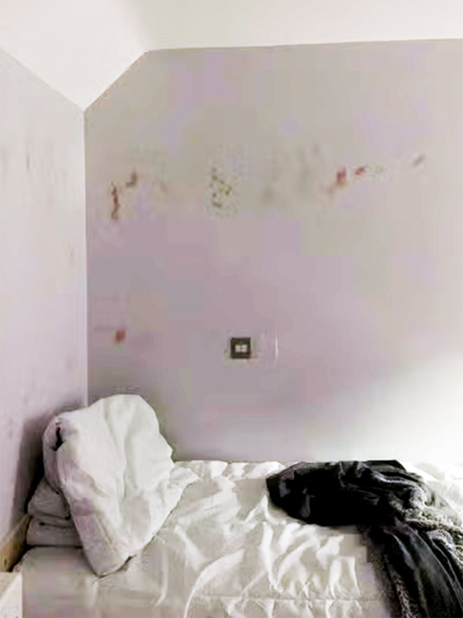 Picture of a patient’s room with blood on the walls