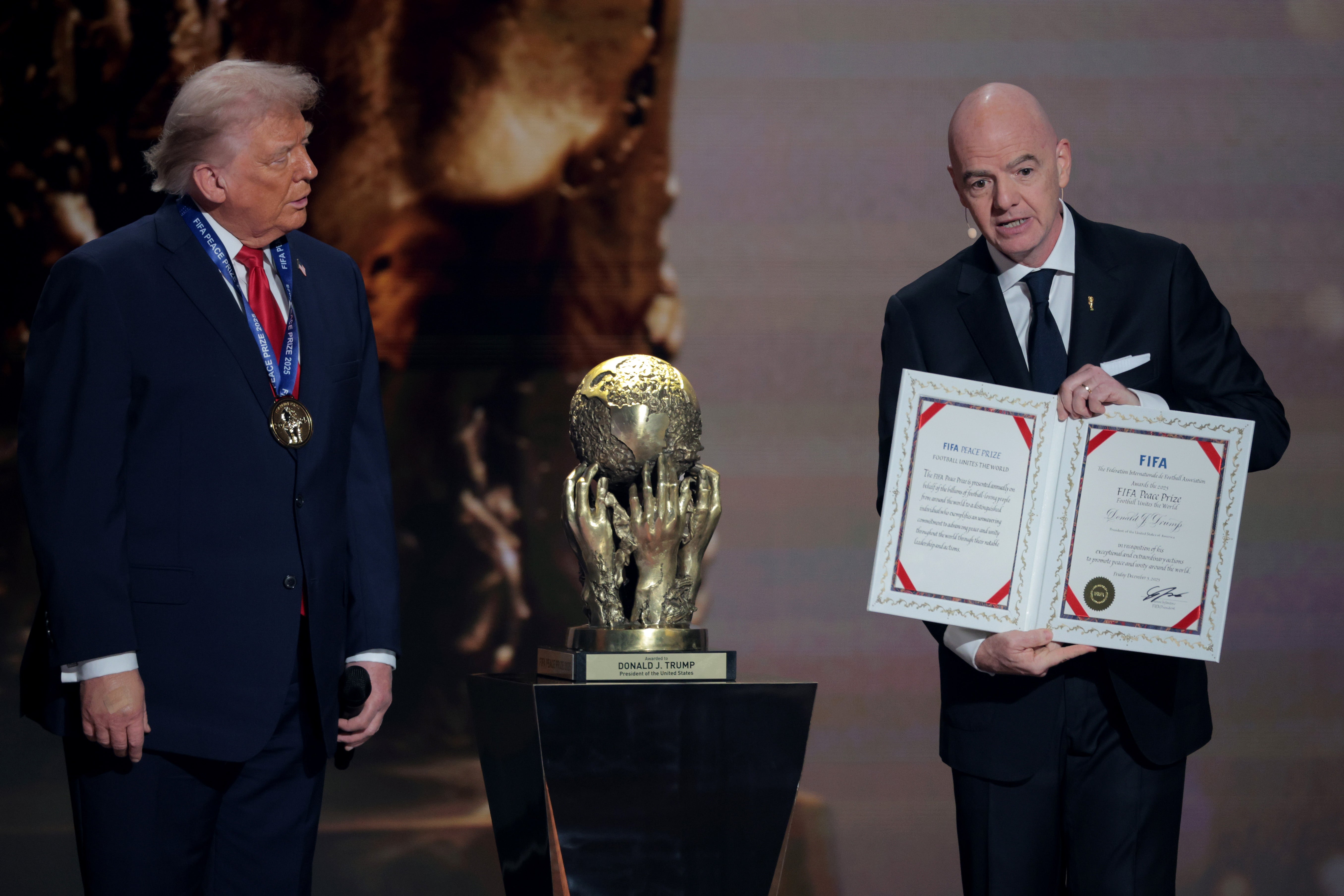 Gianni Infantino, President of FIFA, presents the FIFA Peace Prize for U.S. President Donald Trump