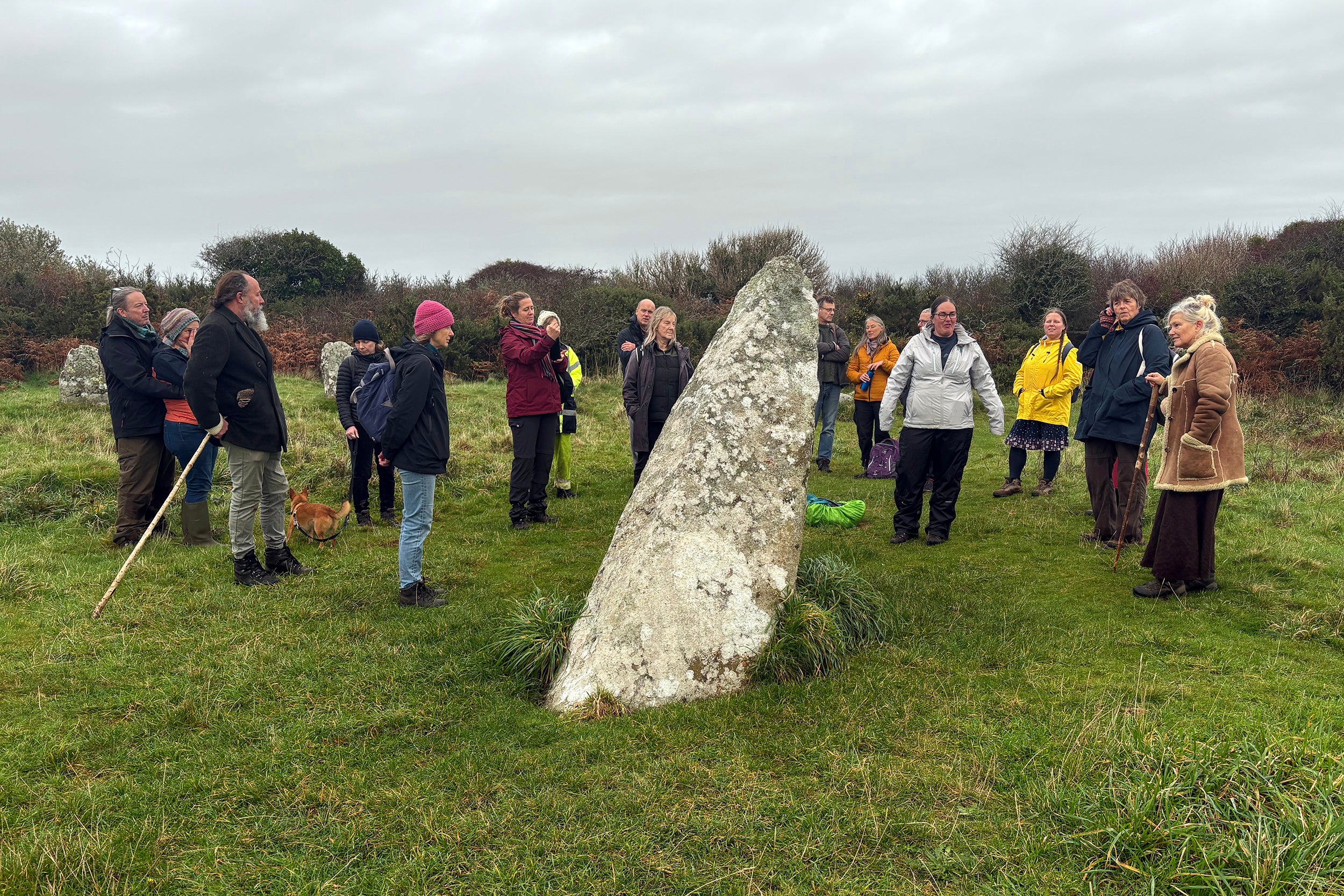 Residents of Cornwall, England, visit the Boscawen-Ûn stone circle near Penzance, Nov. 5, 2025. Carolyn Kennett, center in white jacket, led the guided walk. (Yonat Shimron/Religion News Service via AP)