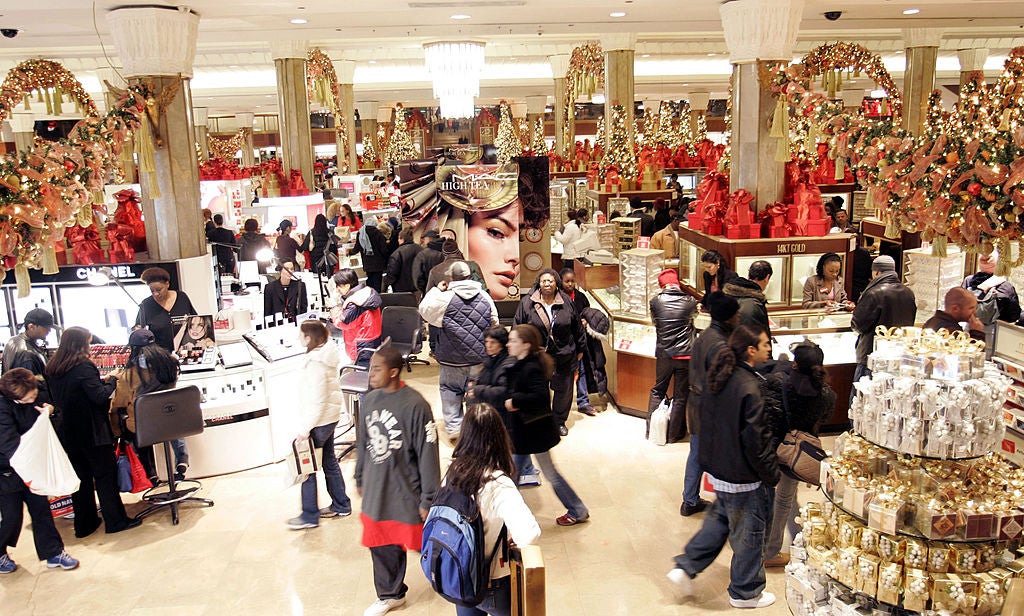 Holiday shoppers search for gifts at Macy’s in New York City. Scammers target shoppers — and sellers — during the holiday gift buying rush