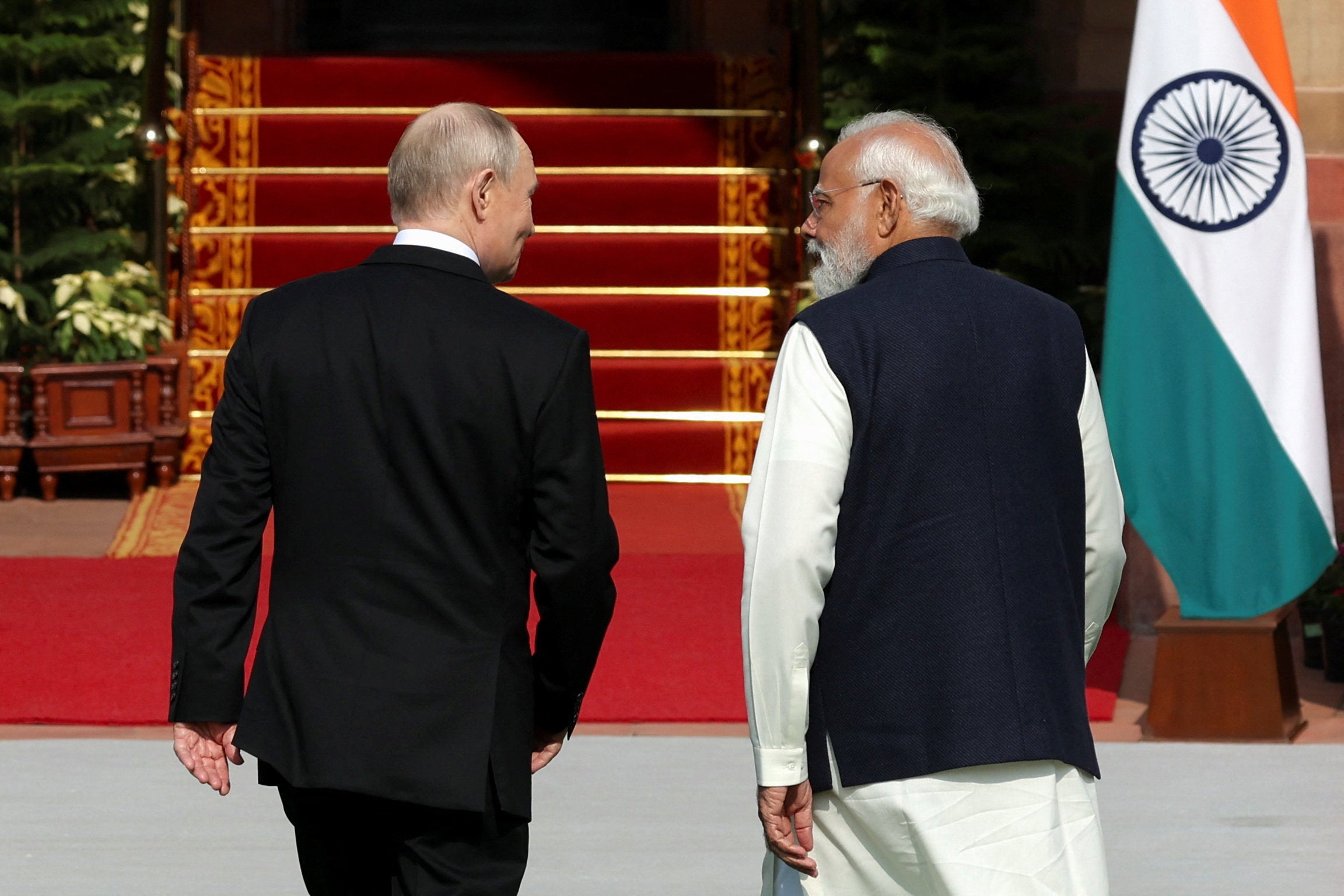 Vladimir Putin and Narendra Modi walk ahead of their meeting at Hyderabad House in New Delhi