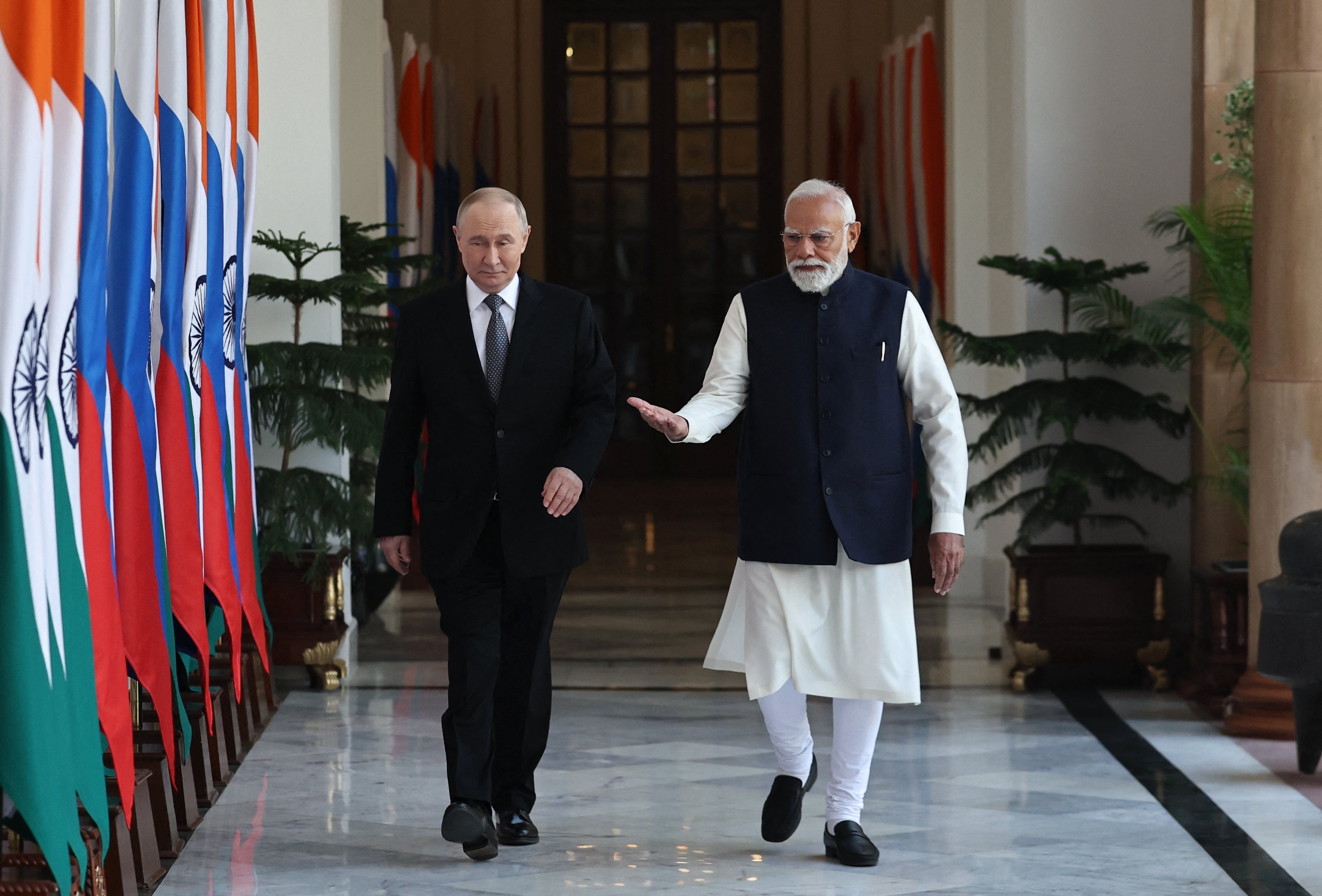 <p>Russia's President Vladimir Putin and India's Prime Minister Narendra Modi walk prior to their talks at the Hyderabad House in New Delhi on December 5, 2025</p>