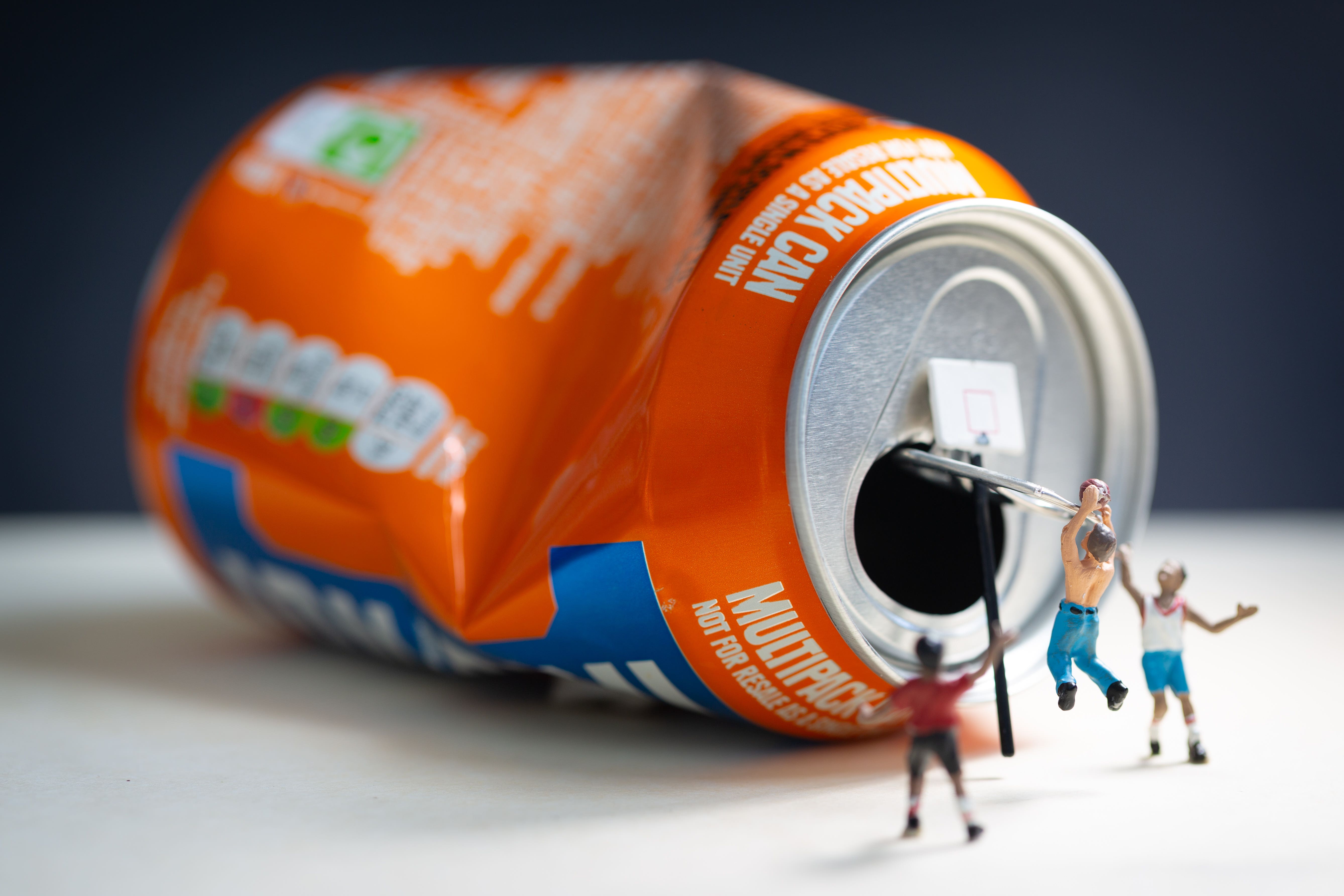 A group of tiny figures played basketball on a can of Irn-Bru in one of the images (Gordonstoun/PA)