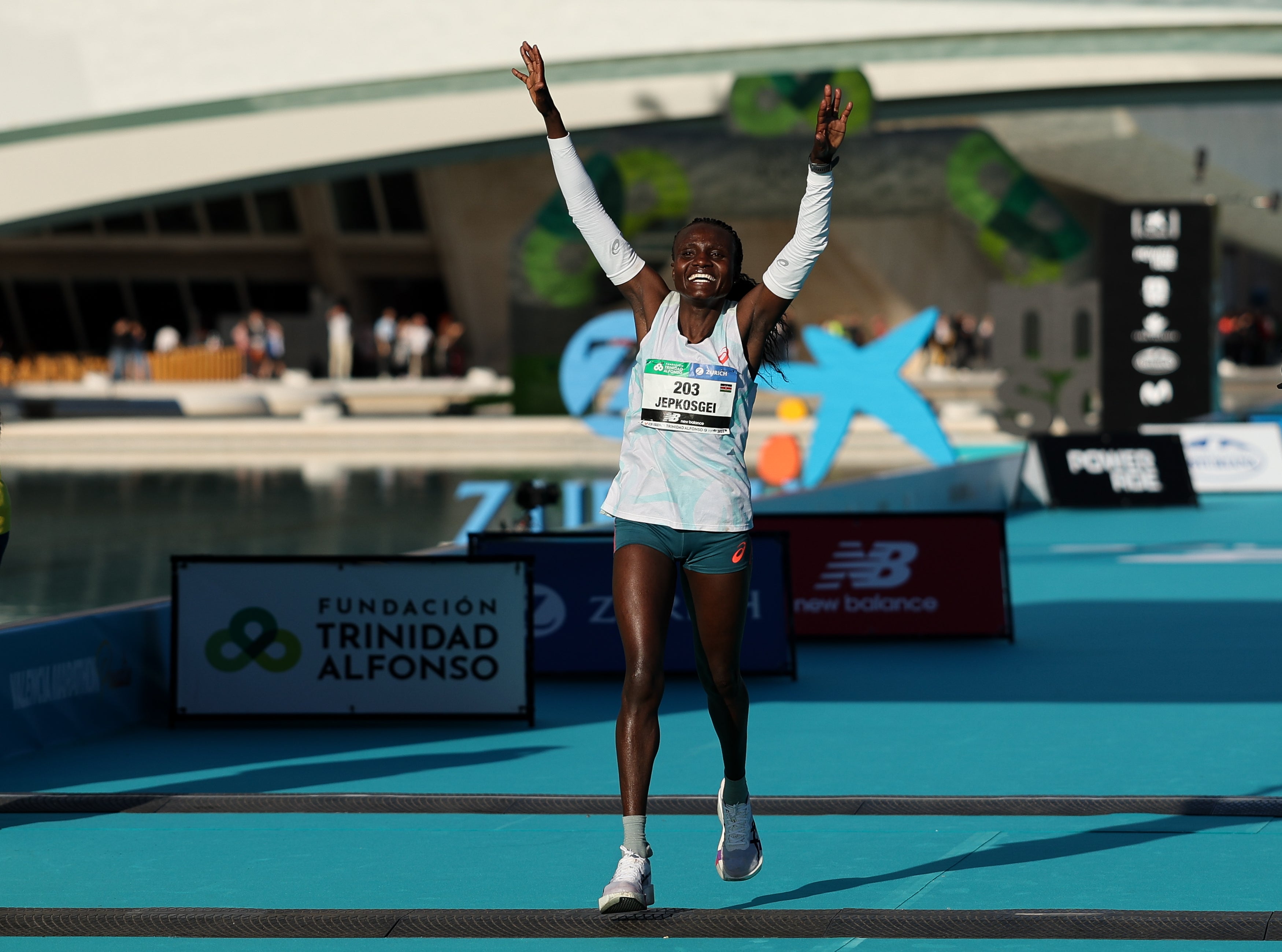 Joyciline Jepkosgei from Kenya the finish line in first position