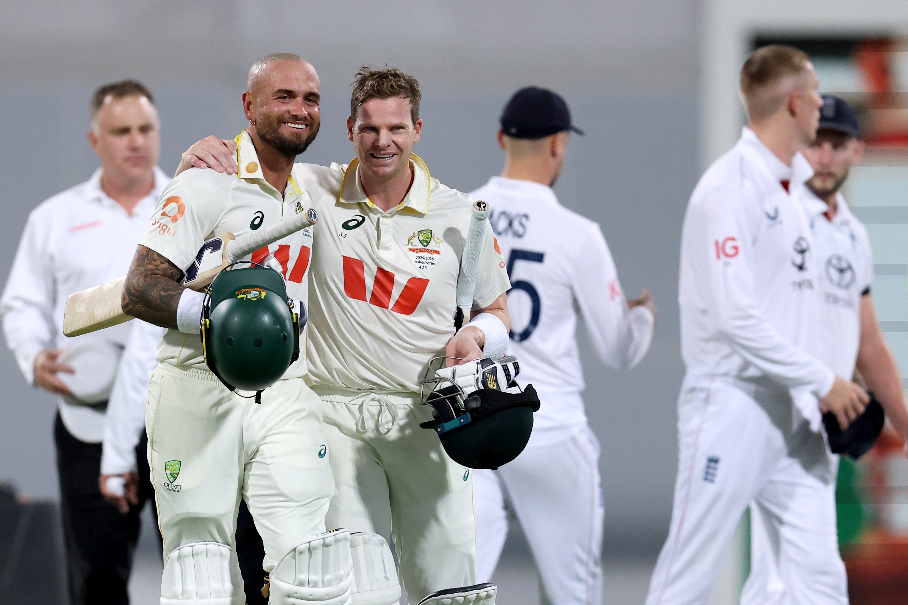 Australia’s captain Steve Smith (C) celebrates with teammate Jake Weatherald (2nd L) after hitting the winning runs