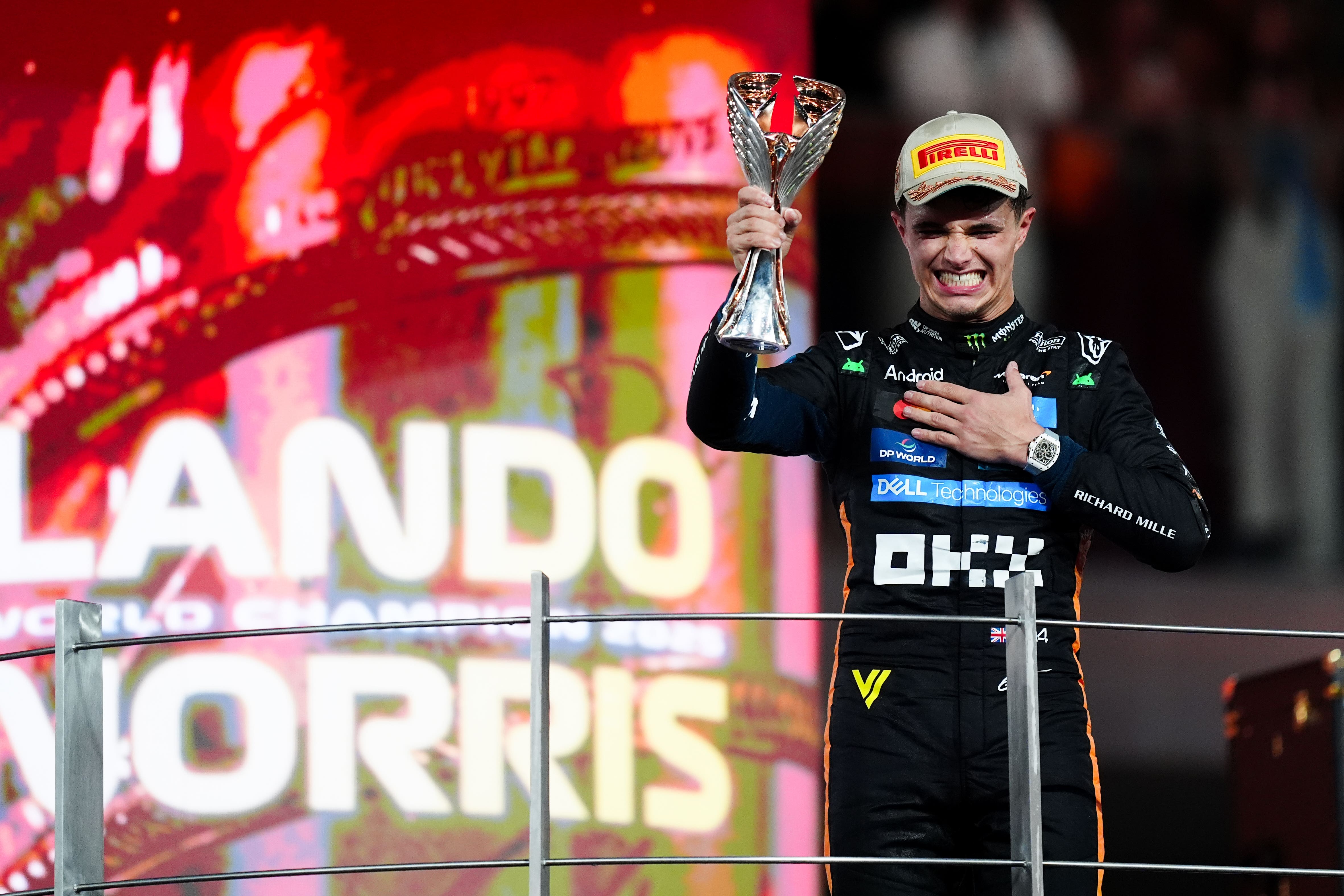 McLaren driver Lando Norris celebrates winning the Formula One world championship (David Davies/PA)