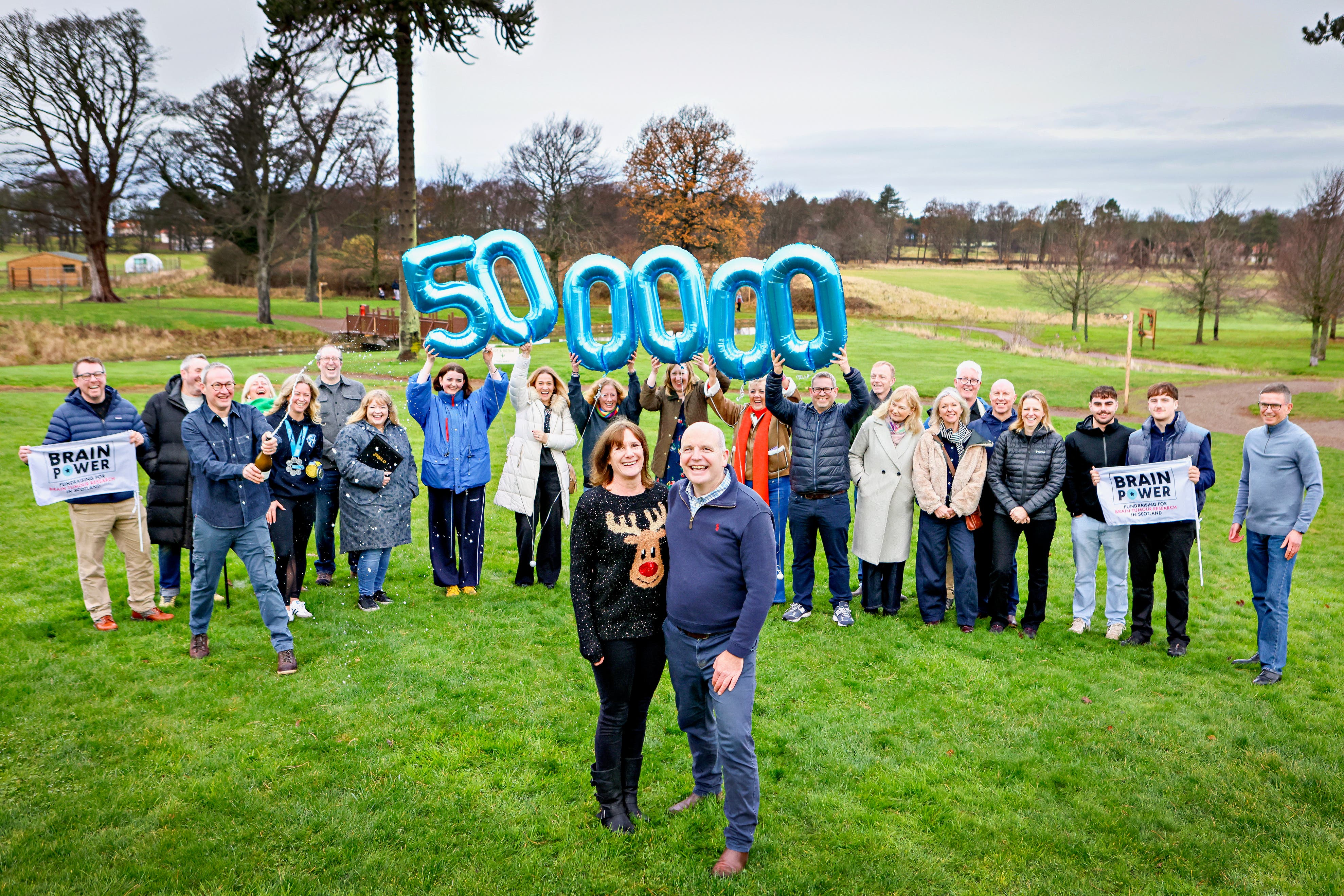 Glenn Campbell and his wife Claire Gardner, along with family and friends at Archerfield Walled Garden in East Lothian, celebrating Brain Power raising £500,000 (Lewis Houghton/PA)