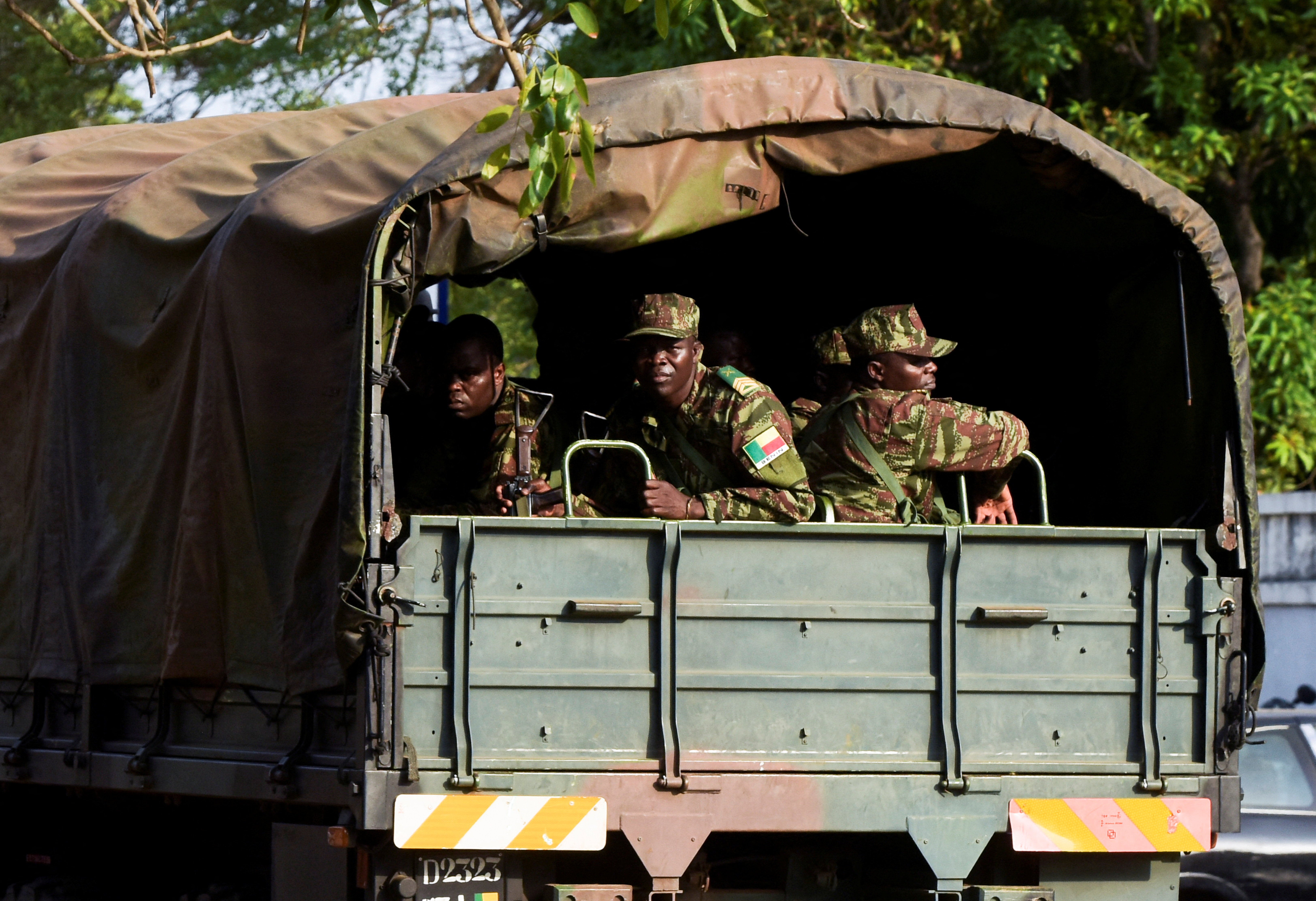 Soldiers patrol in a military vehicle after, according to Benin's Interior Minister Alassane Seidou, the country's armed forces thwarted the attempted coup against the government of Benin's President Patrice Talon,