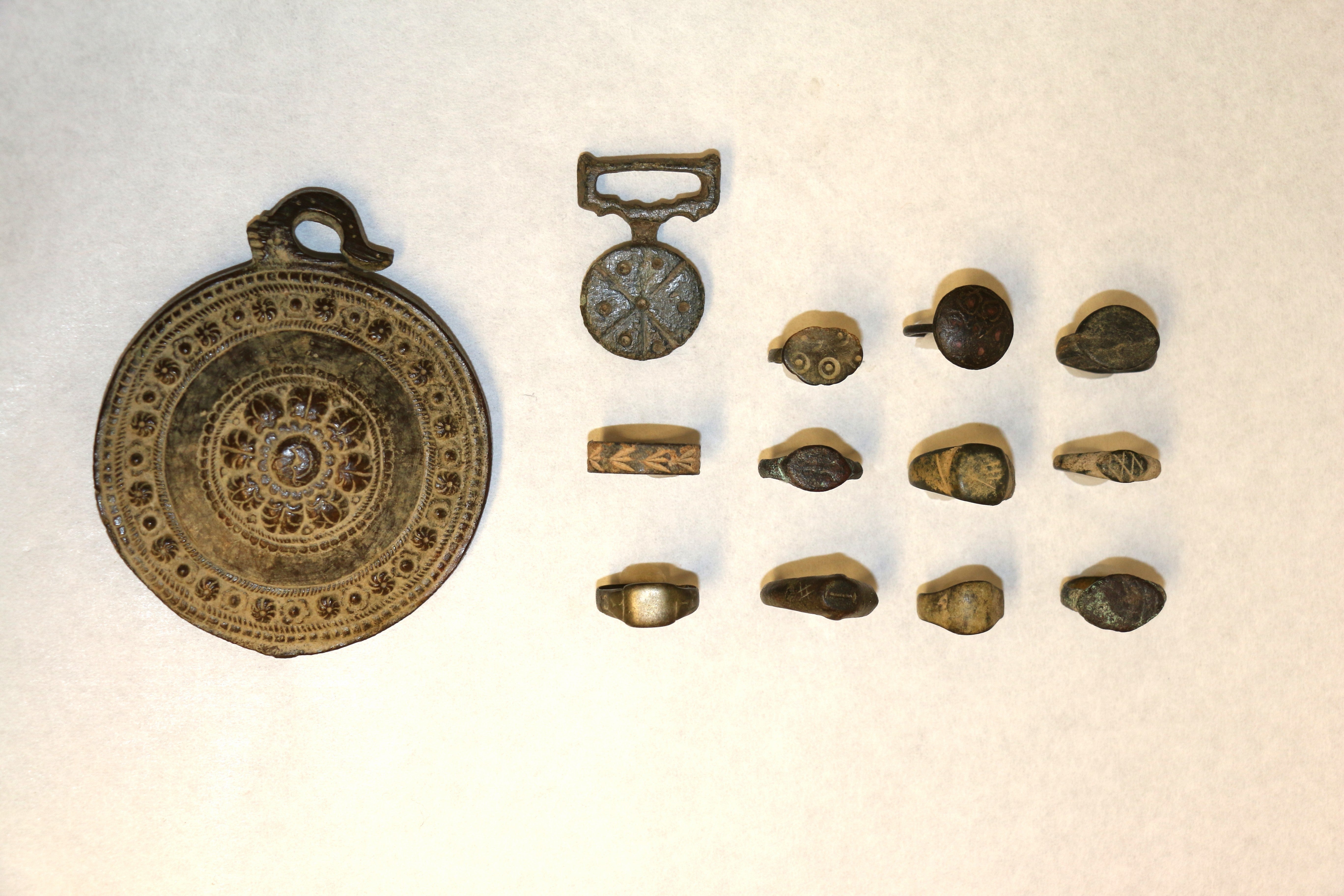 <p>The 11 rings and two medallions brought in from a thrift store in Chilliwack, B.C</p>
