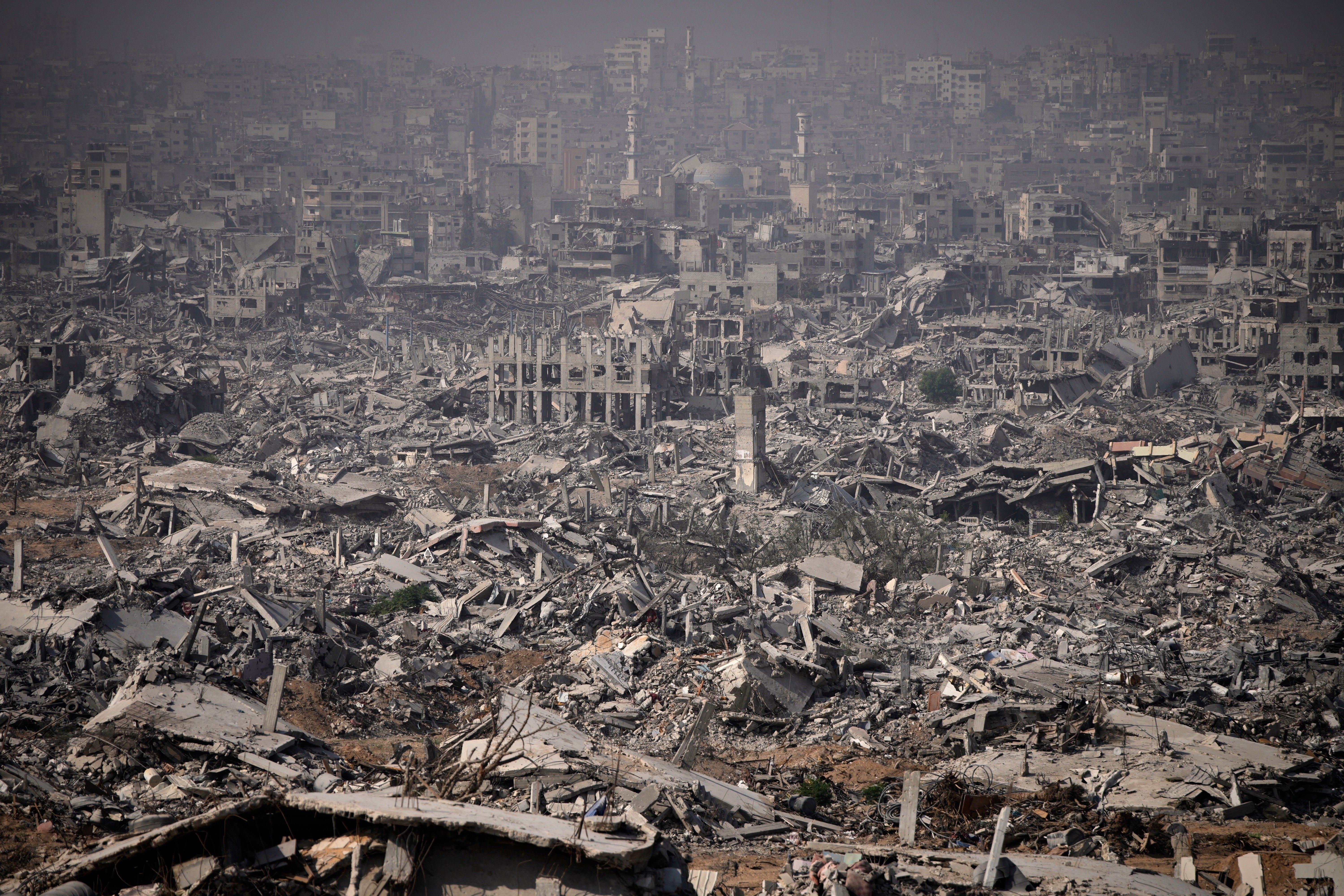 <p>Buildings destroyed by the Israeli military are in ruins around the Shijaiya neighborhood of Gaza City</p>