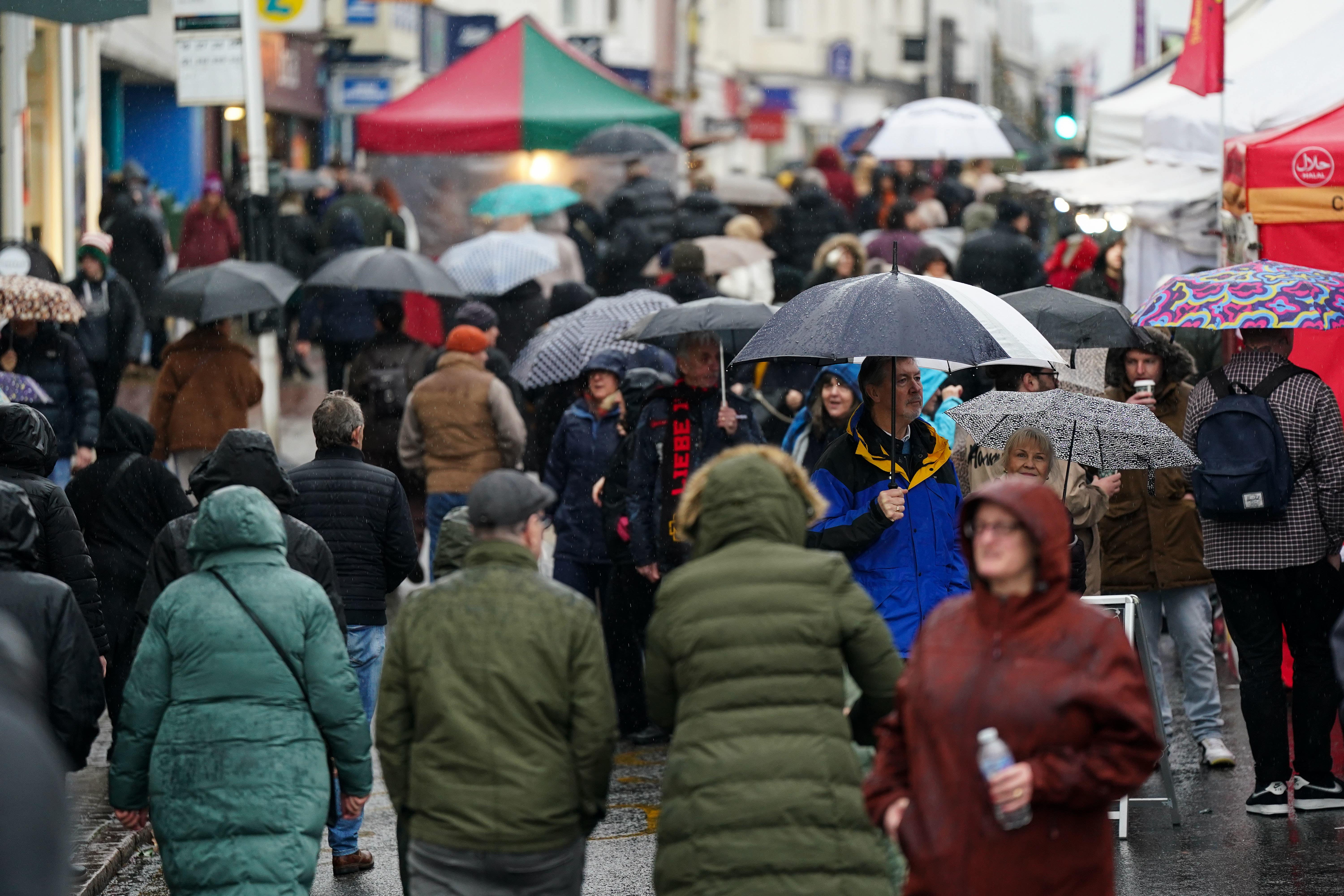 People in Stratford-upon-Avon during wet weather (Jacob King/PA)