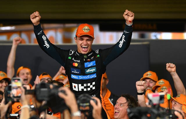 <p>The driver celebrates with his team after the Grand Prix of Abu Dhabi at Yas Marina Circuit on Sunday</p>