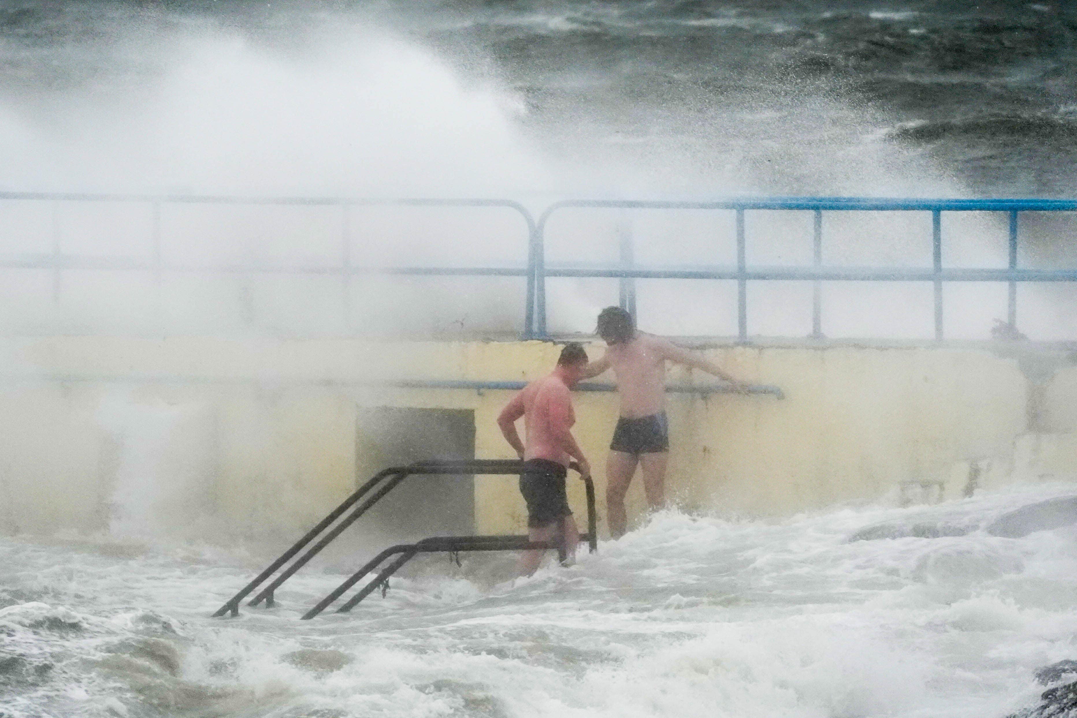 People on Blackrock diving tower in Salthill, Galway during the last named storm