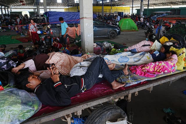 <p>Local people take refuge in Prey Chamkar Ta Doak market in Banteay Meanchey province in Cambodia, near the border with Thailand</p>