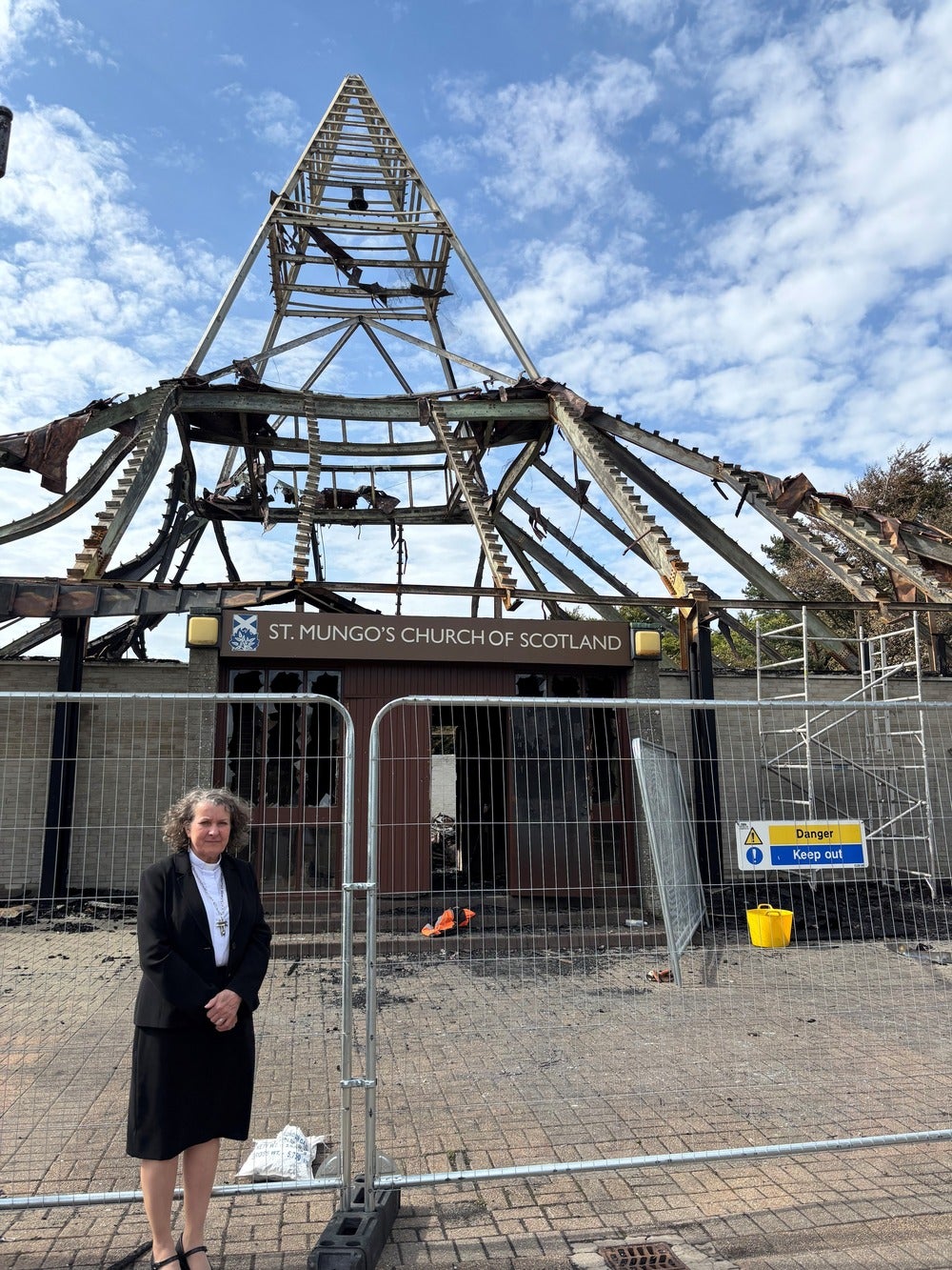 Reverend Rosie Frew outside the remains of St Mungo’s Church, Cumbernauld, which was destroyed by fire in August