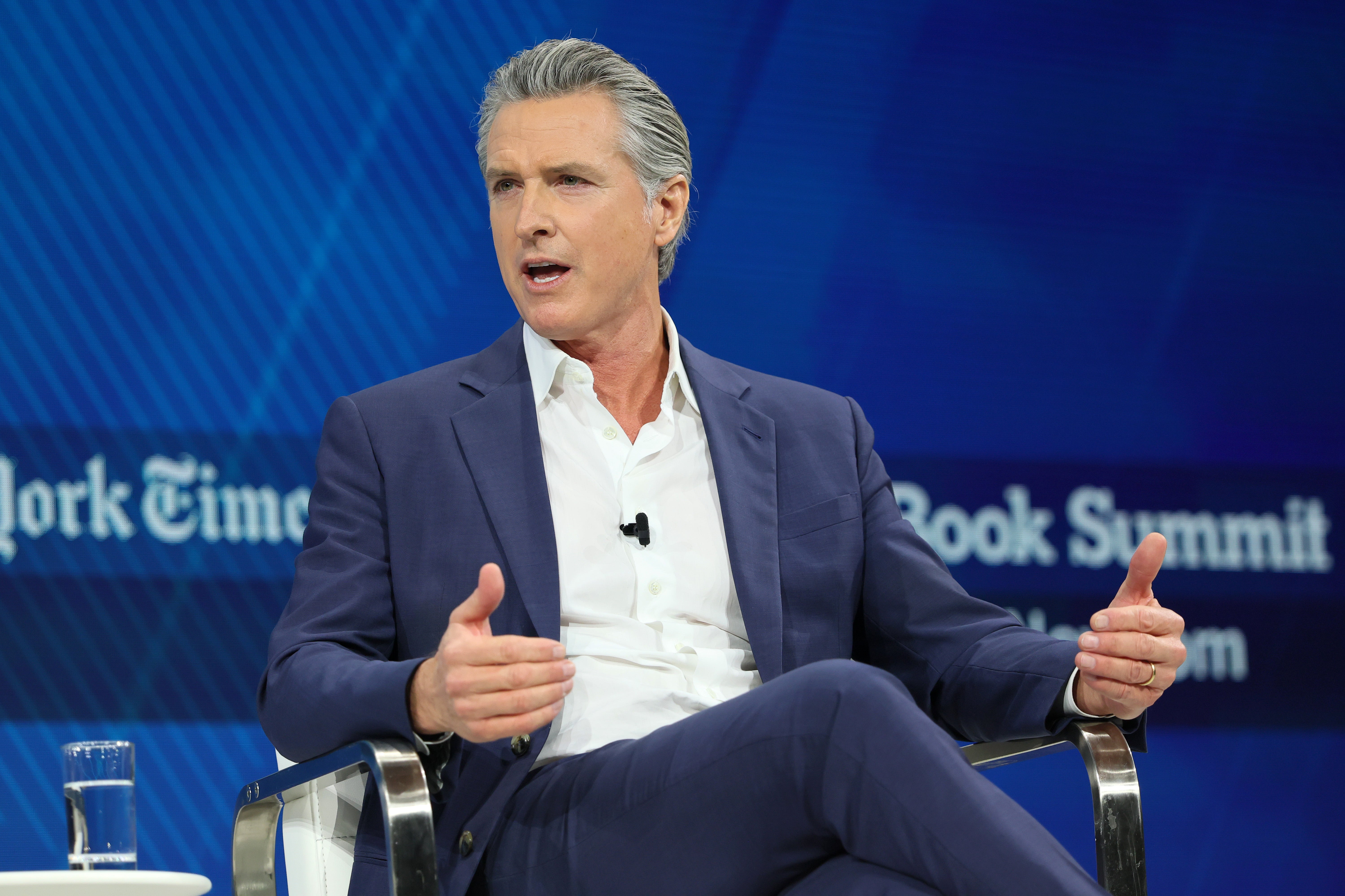 In the image Newsom posted, Trump asks a child mowing the White House lawn if he has a "185 IQ."