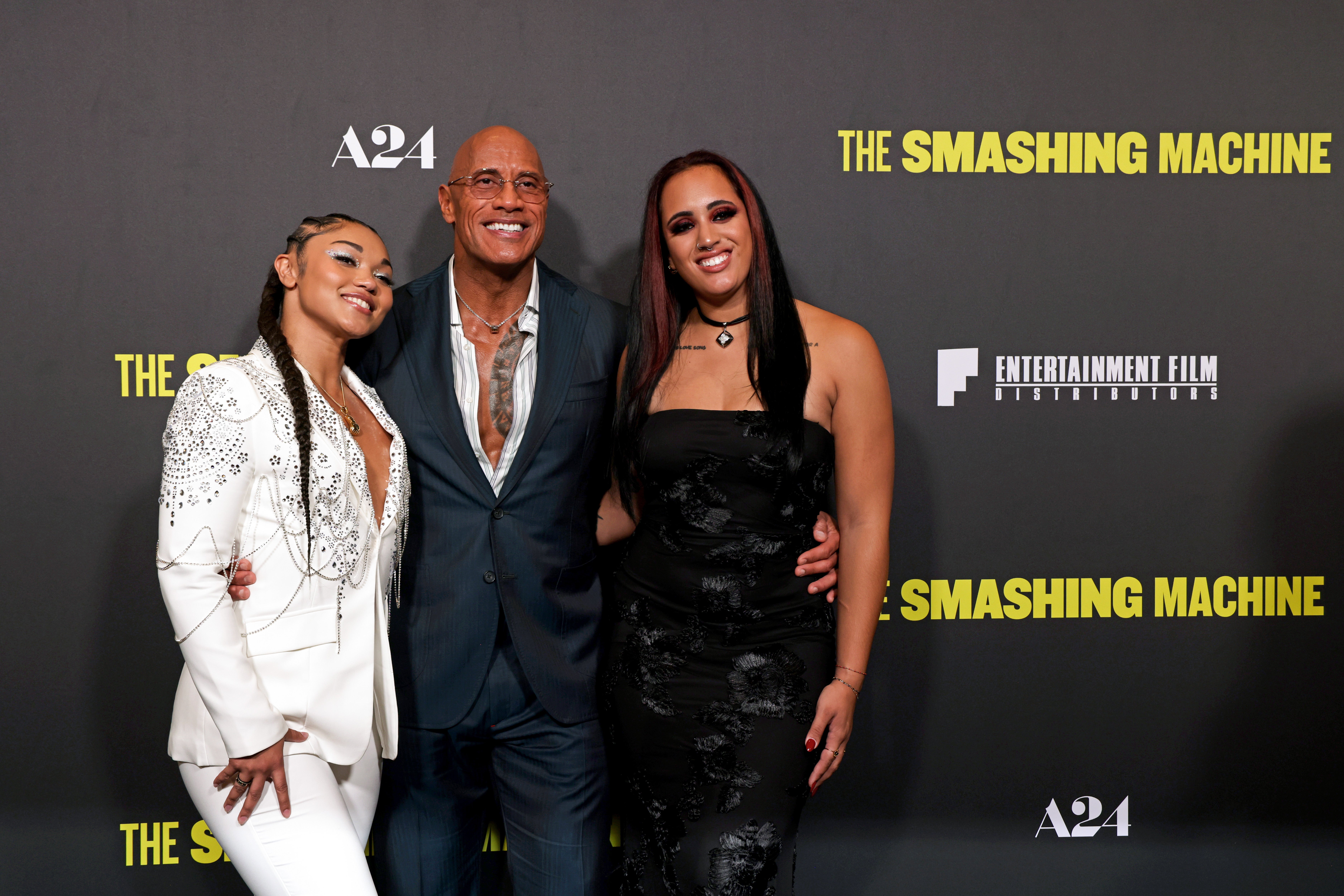 Dwayne Johnson's daughter, Ava Raine (right), has confirmed her romance with WWE star Tatyanna Dumas (left)