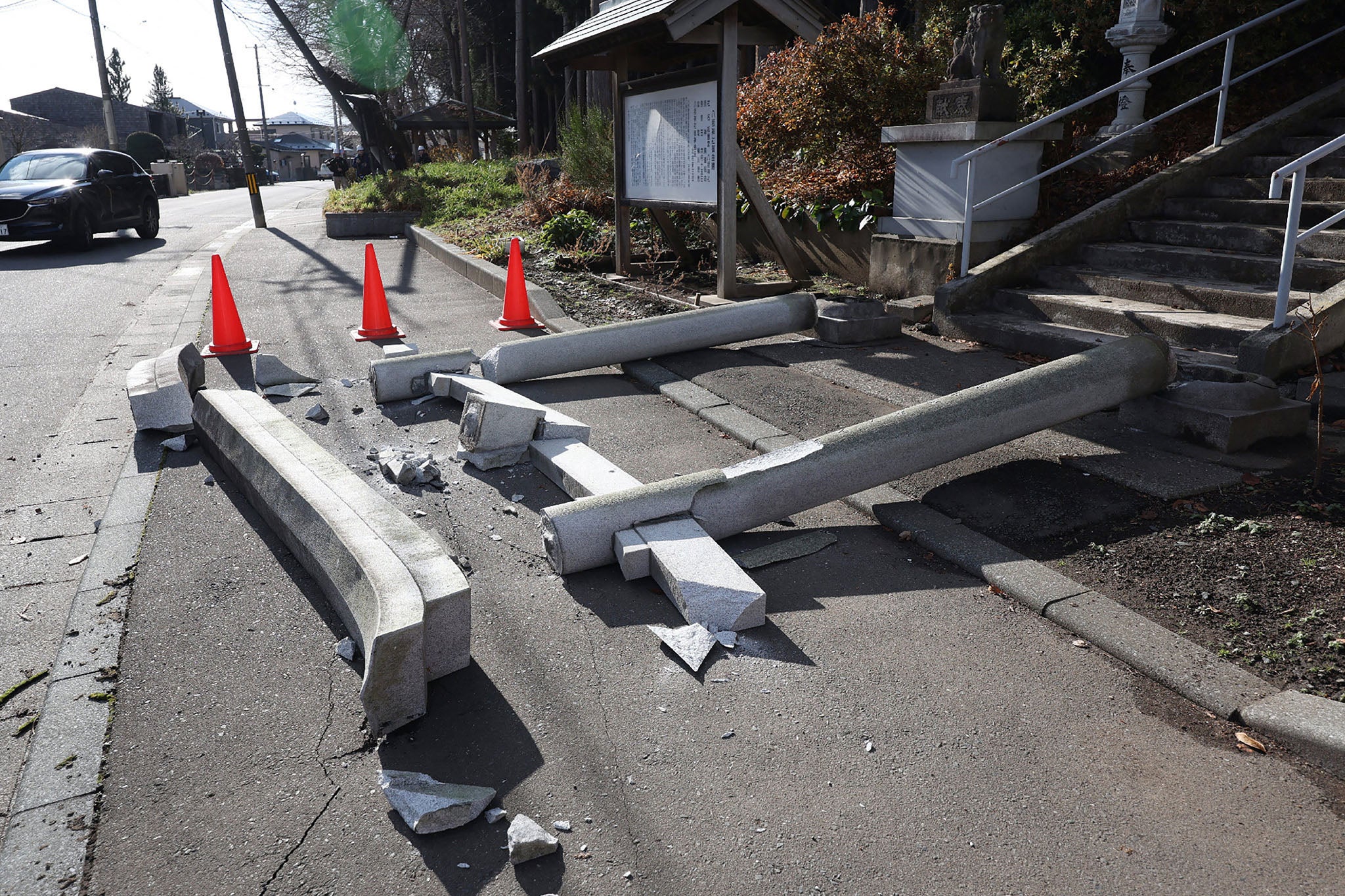 A torii gate at the entrance of Yasaka Shrine is seen after it collapsed onto a sidewalk in Hachinohe City in Aomori Prefecture on 9 December 2025, following a 7.5 magnitude earthquake off northern Japan