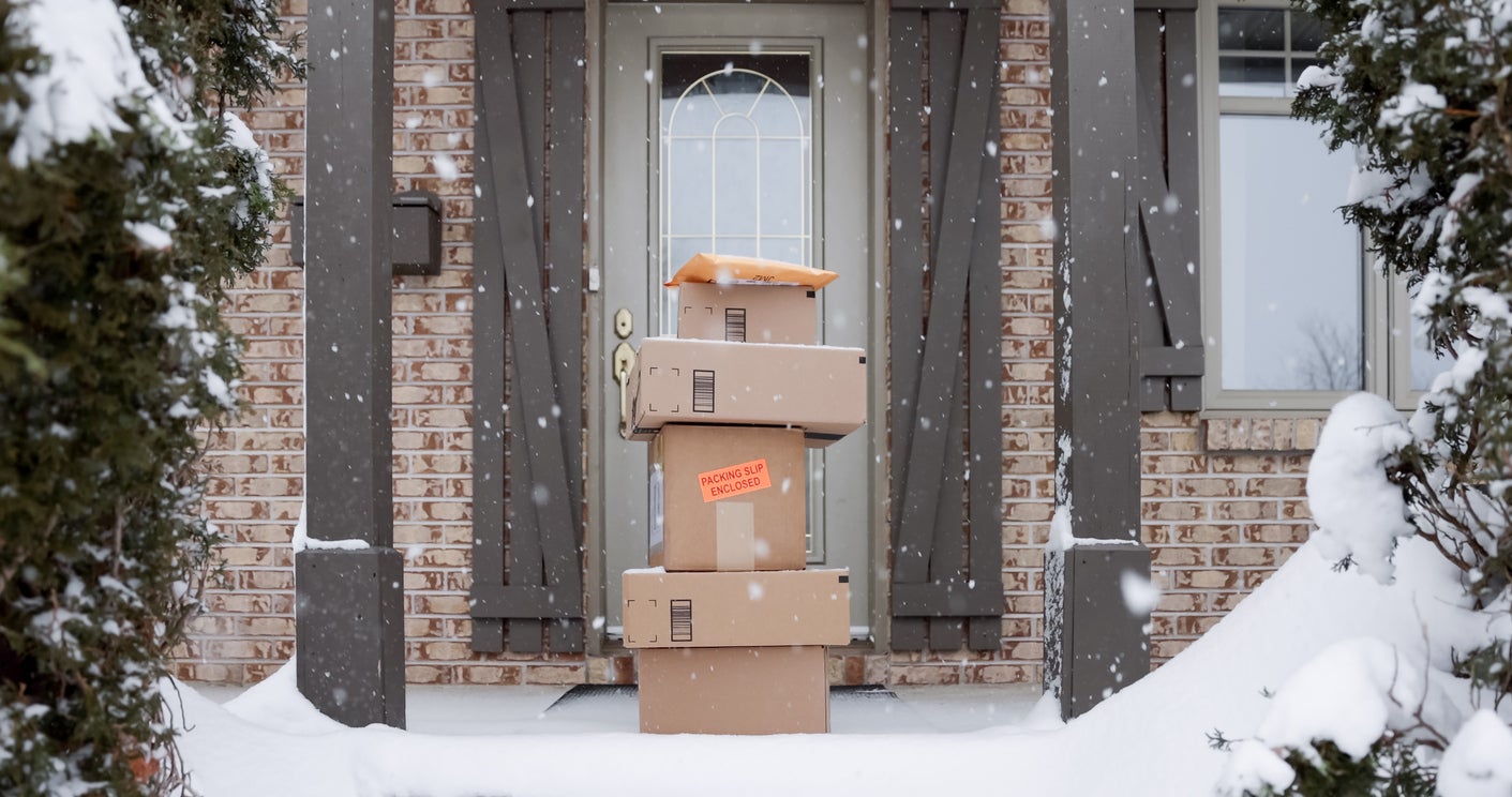 Packages stacked outside a front door