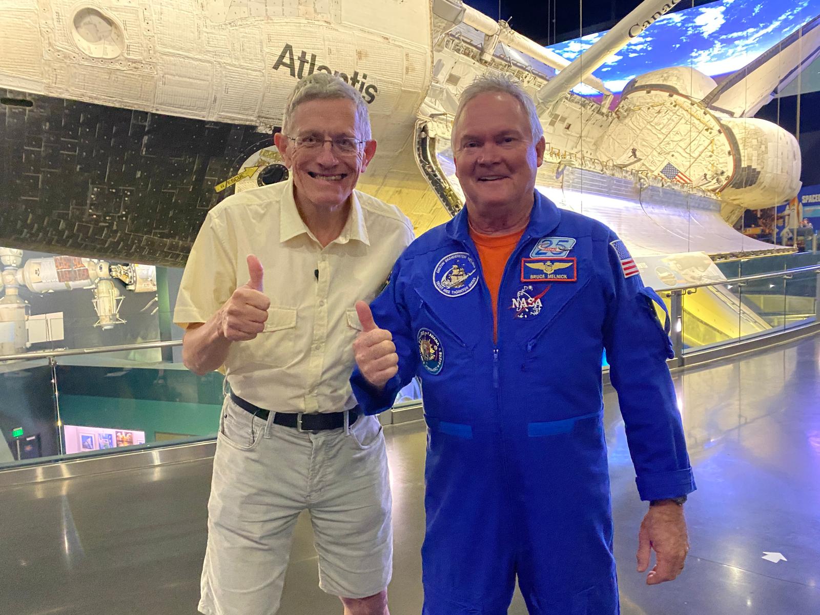 Star man: Astronaut Bruce Melnick (right) and Simon Calder at Kennedy Space Center in Florida, with the Space Shuttle Atlantis in the background