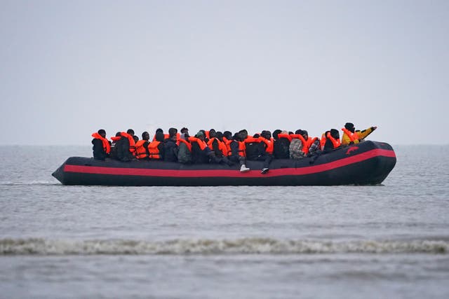 <p>People thought to be migrants onboard a small boat in Gravelines, France (Gareth Fuller/PA)</p>