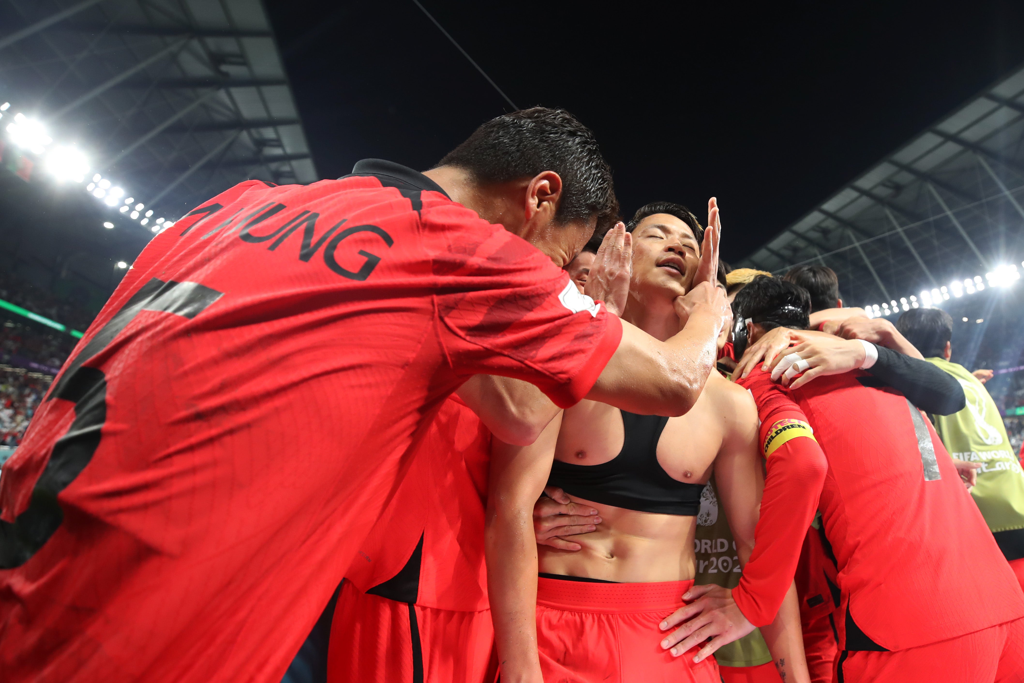 Korea’s Hwang Hee-chan celebrates with teammates at the 2022 World Cup against Portugal