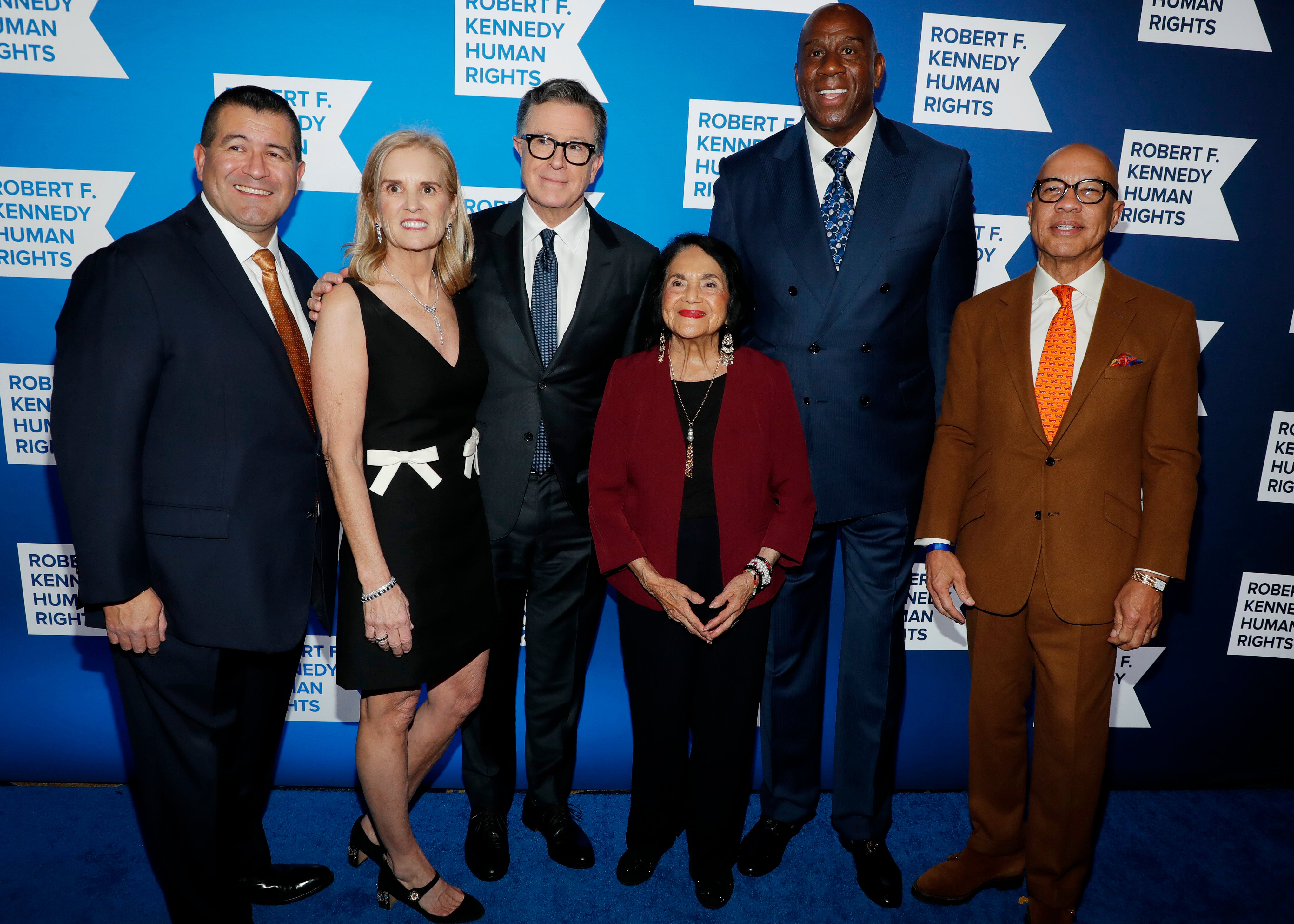 Martin Cabrera Jr., Kerry Kennedy, Stephen Colbert, Dolores Huerta, Earvin "Magic" Johnson, and Darren Walker attend the Robert F. Kennedy Human Rights' 2025 Ripple of Hope Gala at New York Hilton on December 09, 2025 in New York City