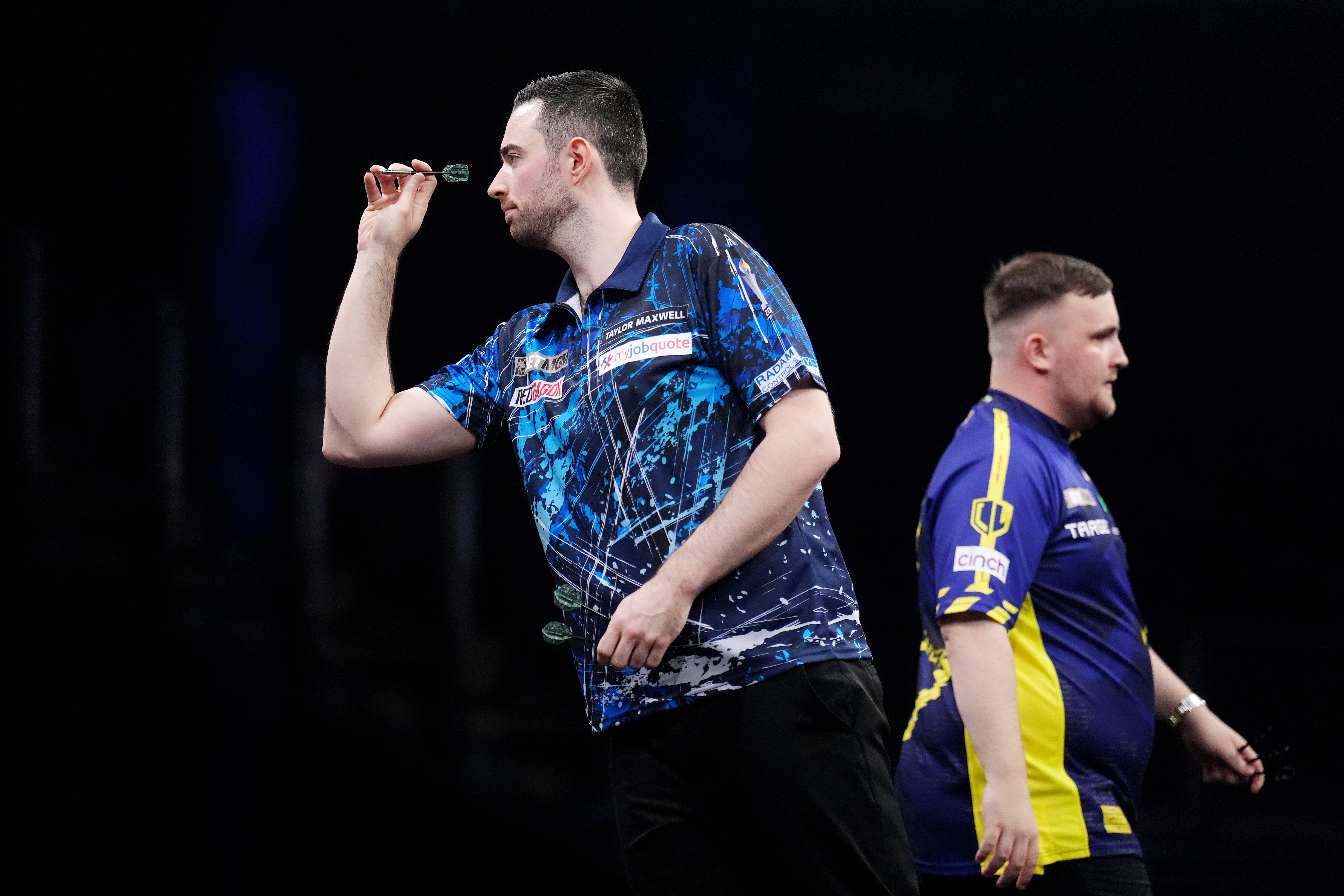 Luke Humphries (left) in action against Luke Littler (John Walton/PA)