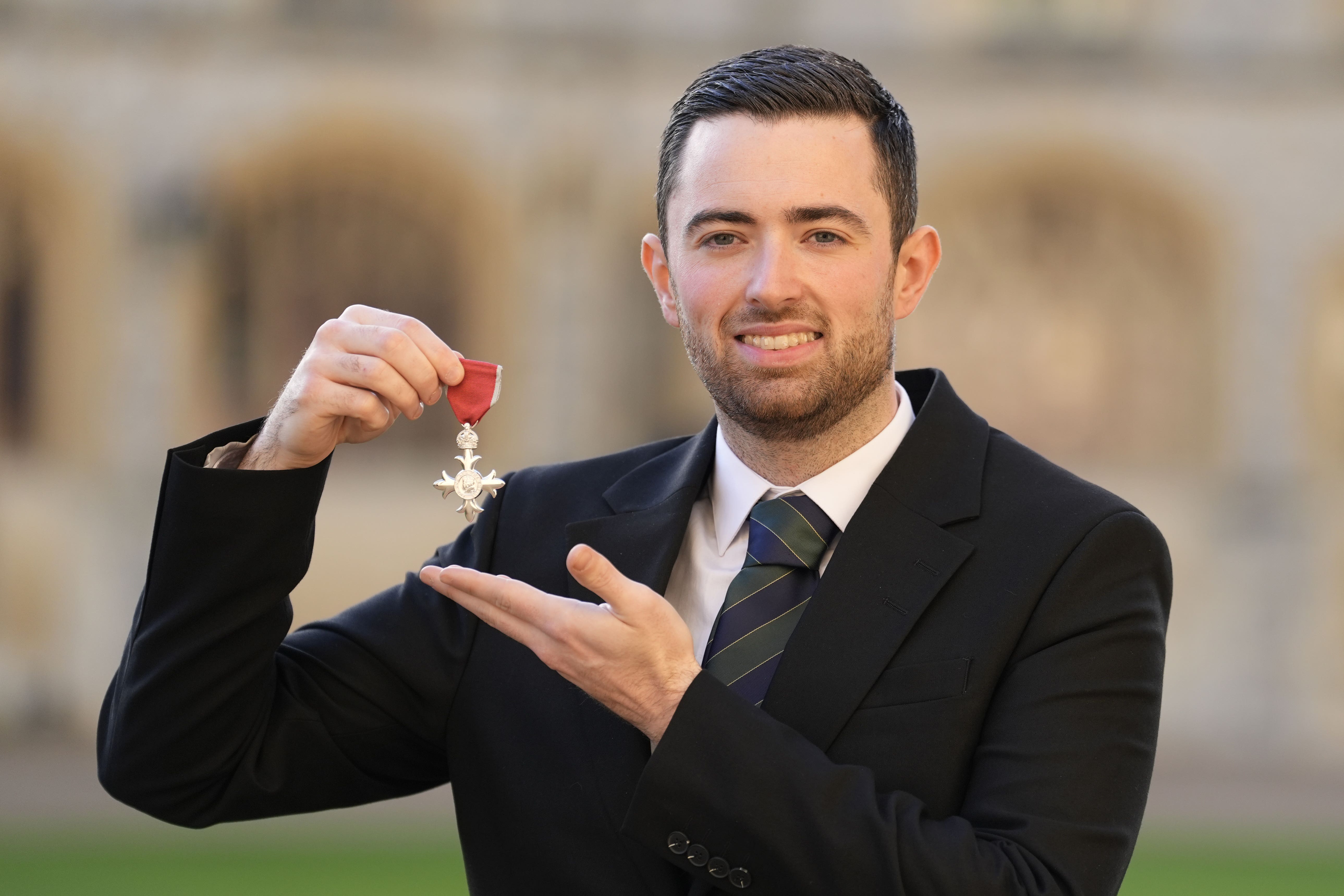Luke Humphries after being made a Member of the Order of the British Empire (Andrew Matthews/PA)