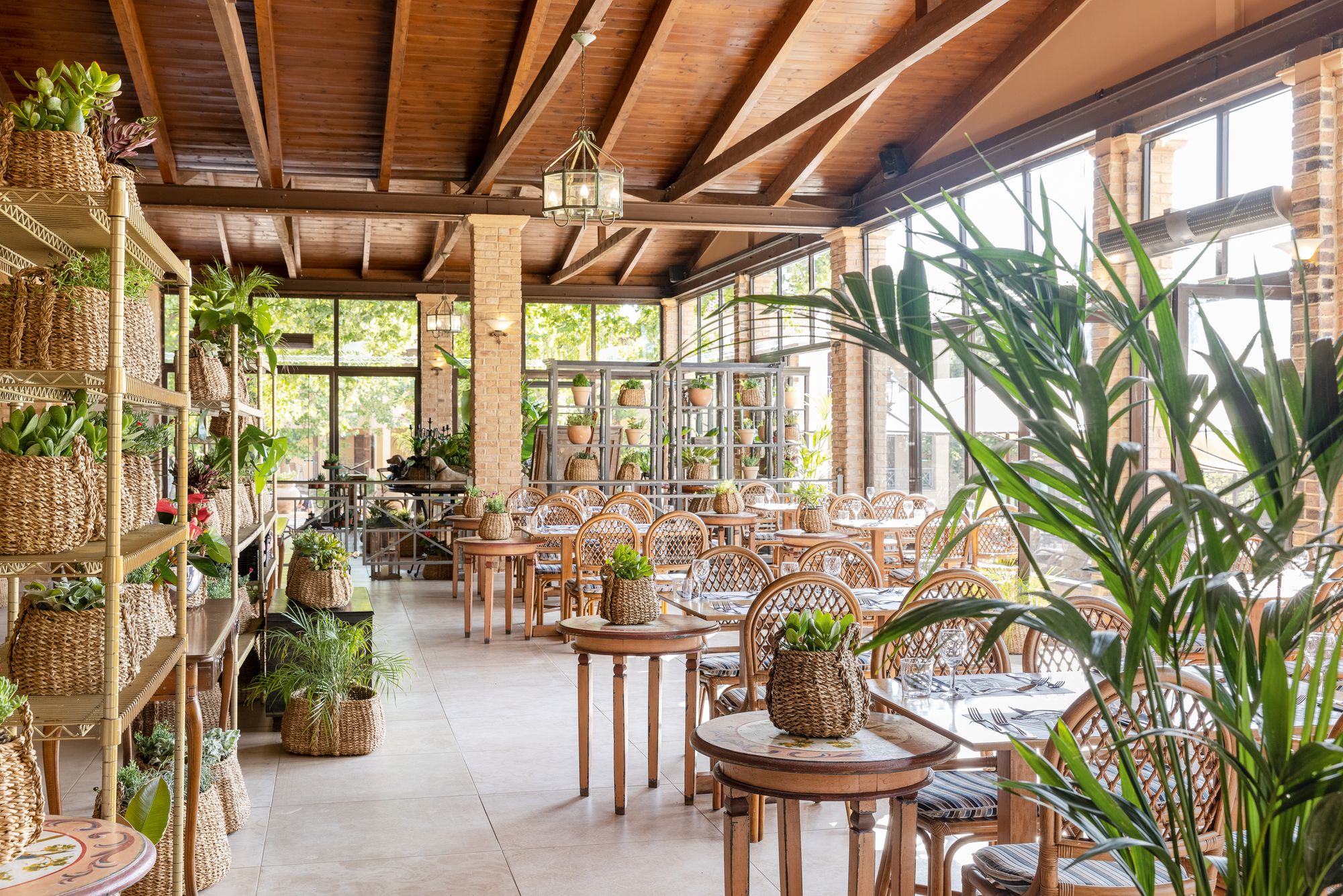 The main restaurant, filled with greenery, where breakfast, lunch and dinner is served