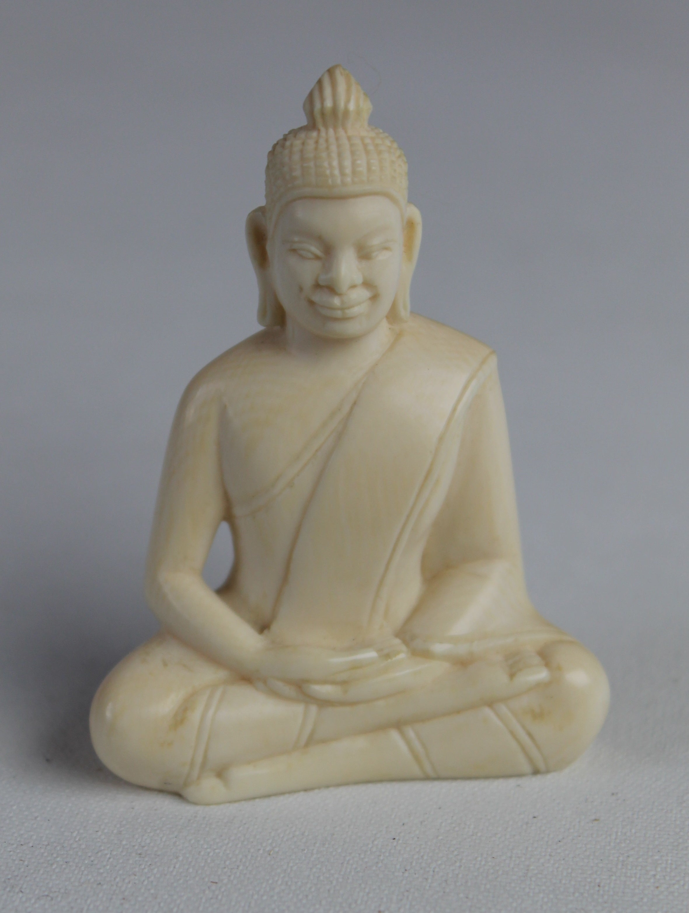 An Ivory Buddha on stone base, one of more than 600 artefacts that were stolen