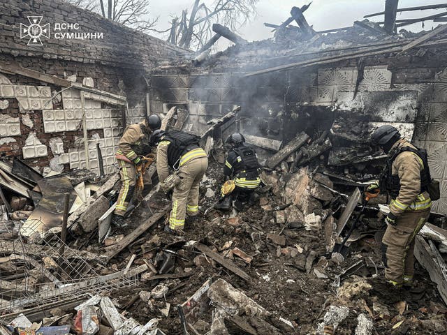 <p>Rescuers work at the site where a store was hit by a Russian airstrike in the Sumy region, Ukraine</p>