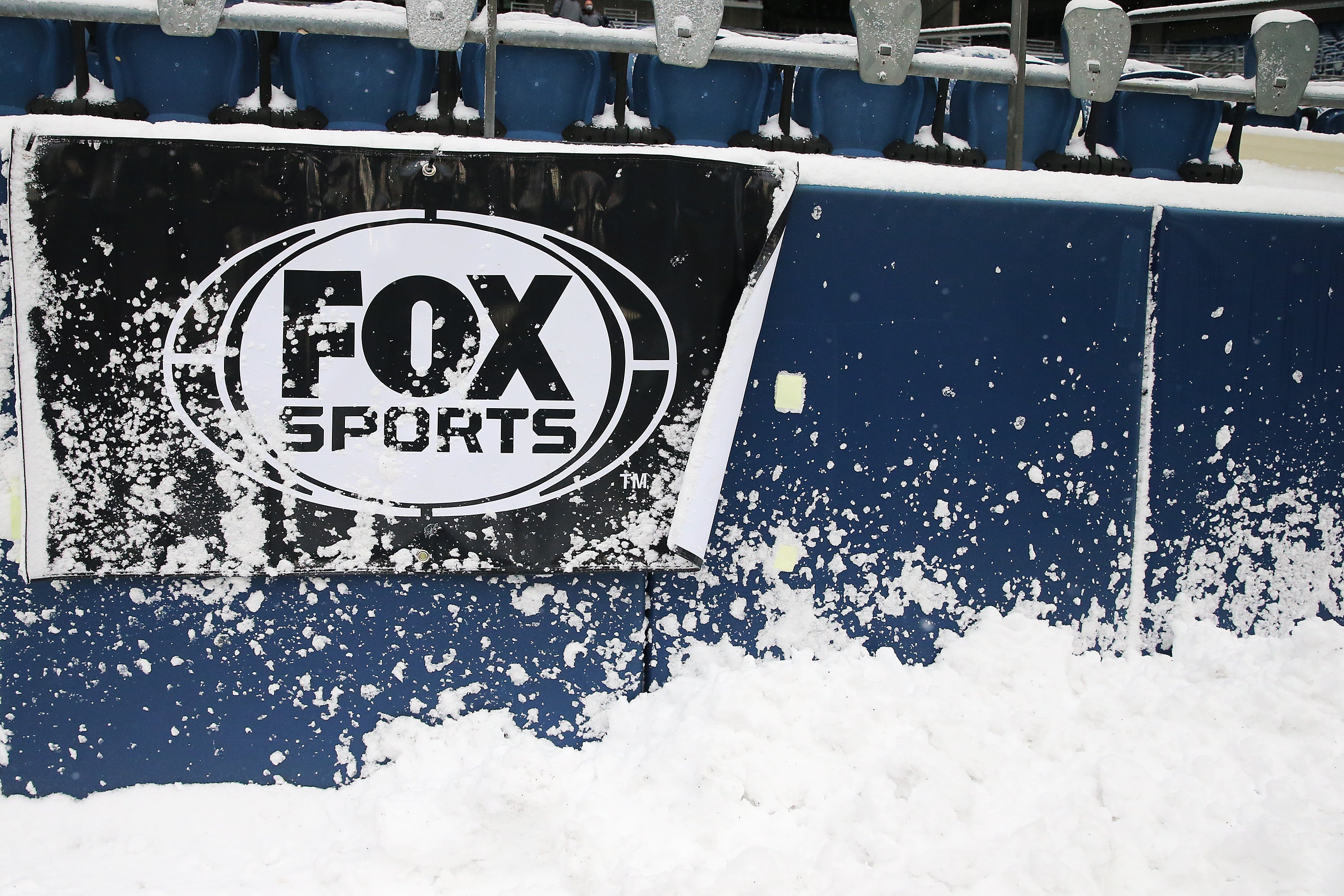 <p>The Fox Sports logo on the wall at Lumen Field before the game between the Seattle Seahawks and Chicago Bears on December 26, 2021 in Seattle, Washington</p>