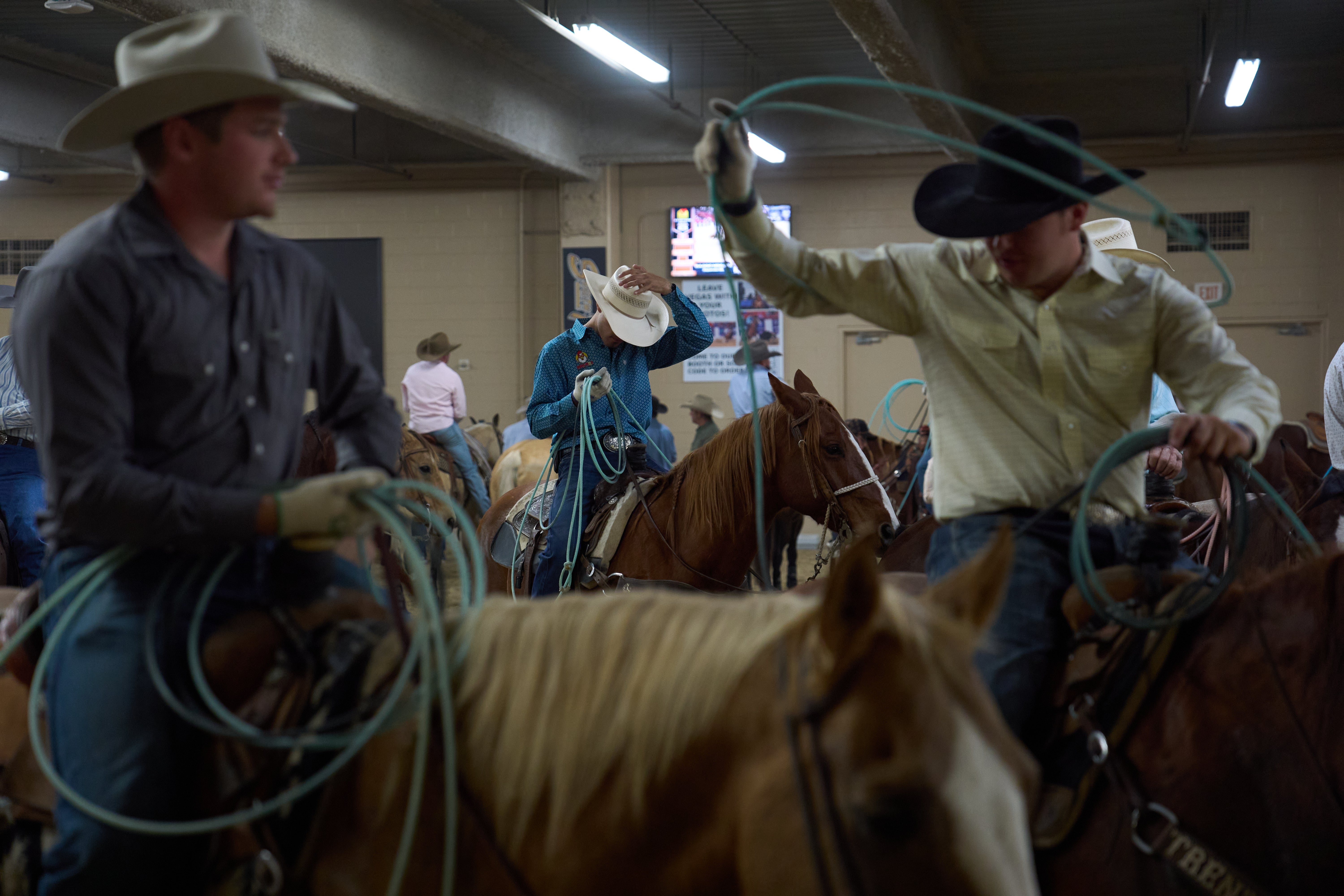 Contestants wait to compete during the World Series of Team Roping at the South Point hotel-casino in Las Vegas Tuesday, Dec. 9, 2025, in Las Vegas
