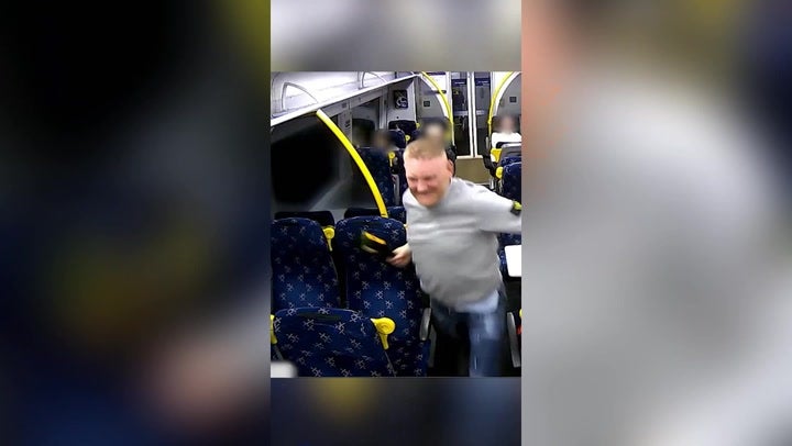 <p>Terrifying moment train passenger launches bottle attack on strangers.</p>