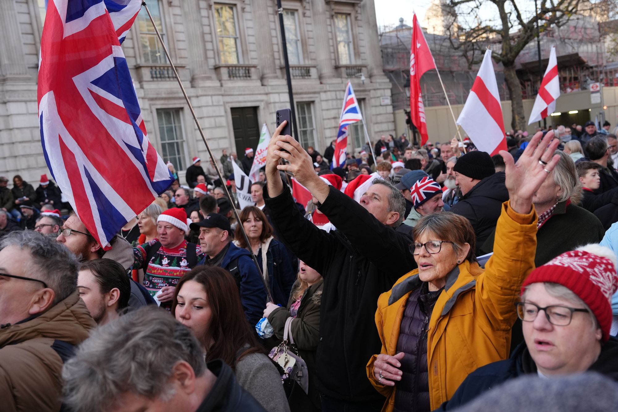 Attendees received hymn sheets, while a vendor sold St George’s flags and Santa hats.