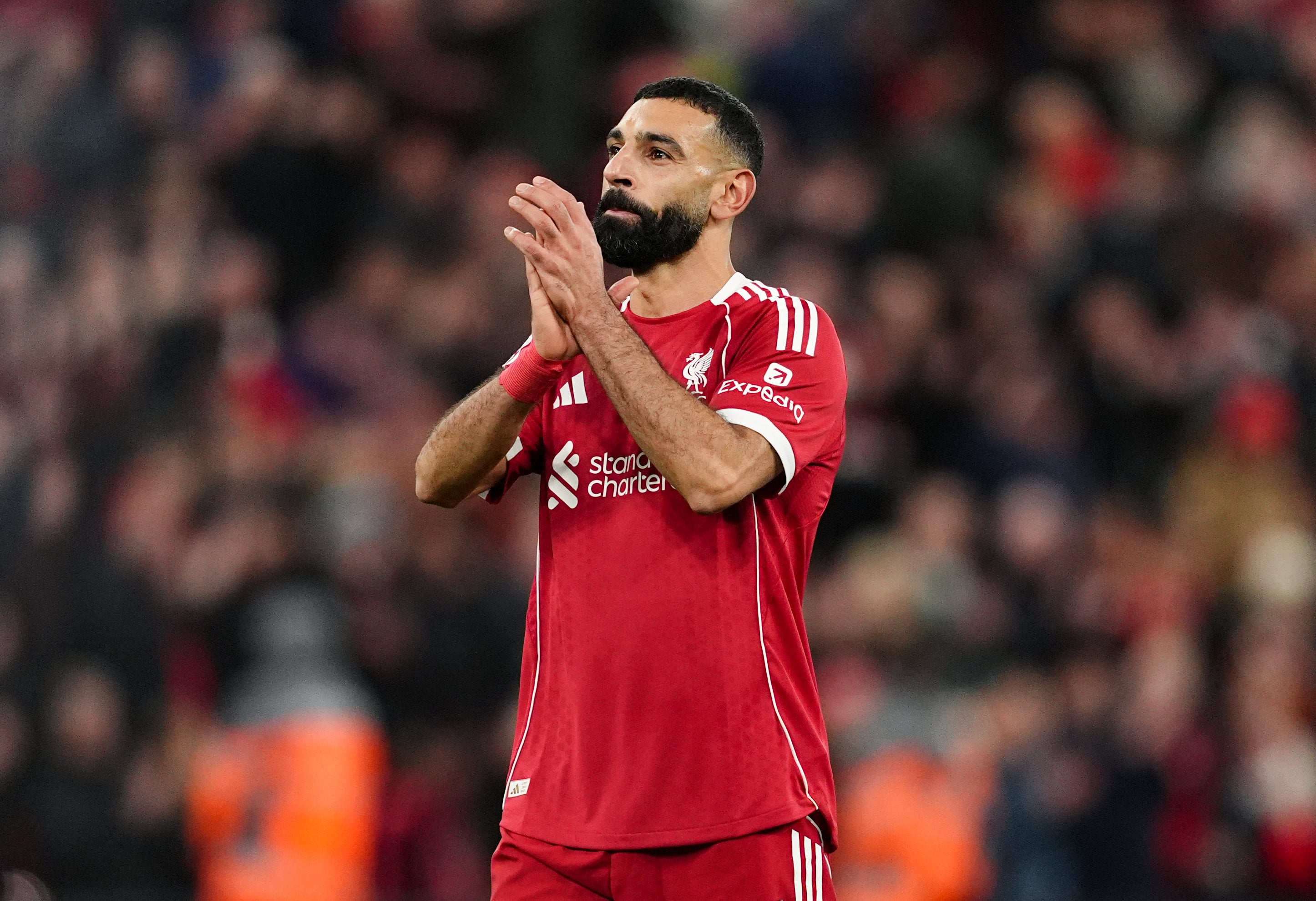 Mohamed Salah applauds the Liverpool fans after victory at Anfield