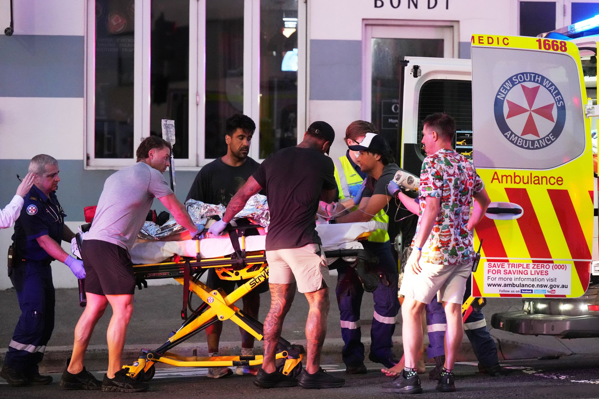 <p>Emergency workers transport a person on a stretcher after a reported shooting at Bondi Beach in Sydney, Sunday, Dec. 14, 2025</p>