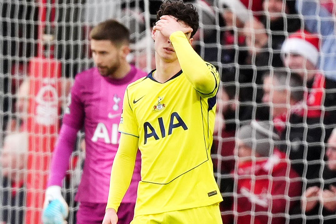 Archie Gray (right) and Tottenham team-mate Guglielmo Vicario react to gifting an opening goal to Nottingham Forest’s Callum Hudson-Odoi (Mike Egerton/PA).