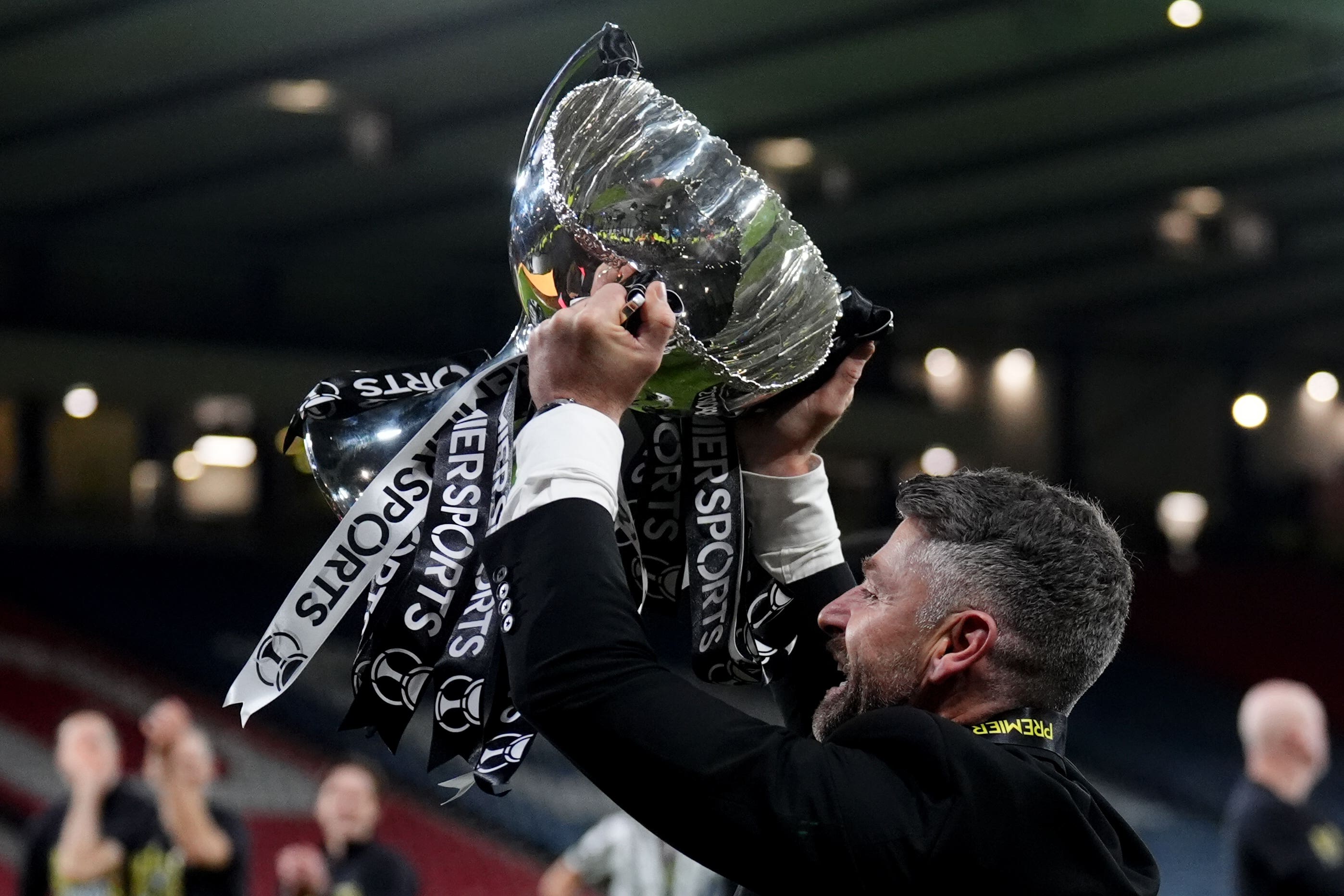 St Mirren manager Stephen Robinson lifts the trophy (Andrew Milligan/PA)