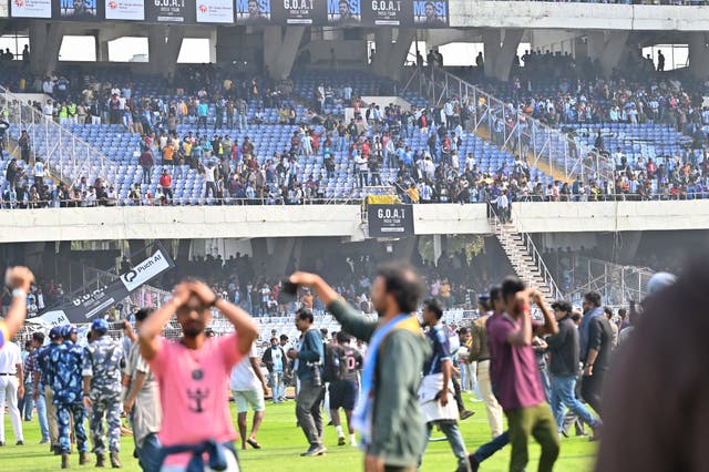 <p>Fans break signage and storm on to the field at Vivekananda Yuva Bharati Krirangan (VYBK) during the Lionel Messi G.O.A.T Tour in Kolkata</p>