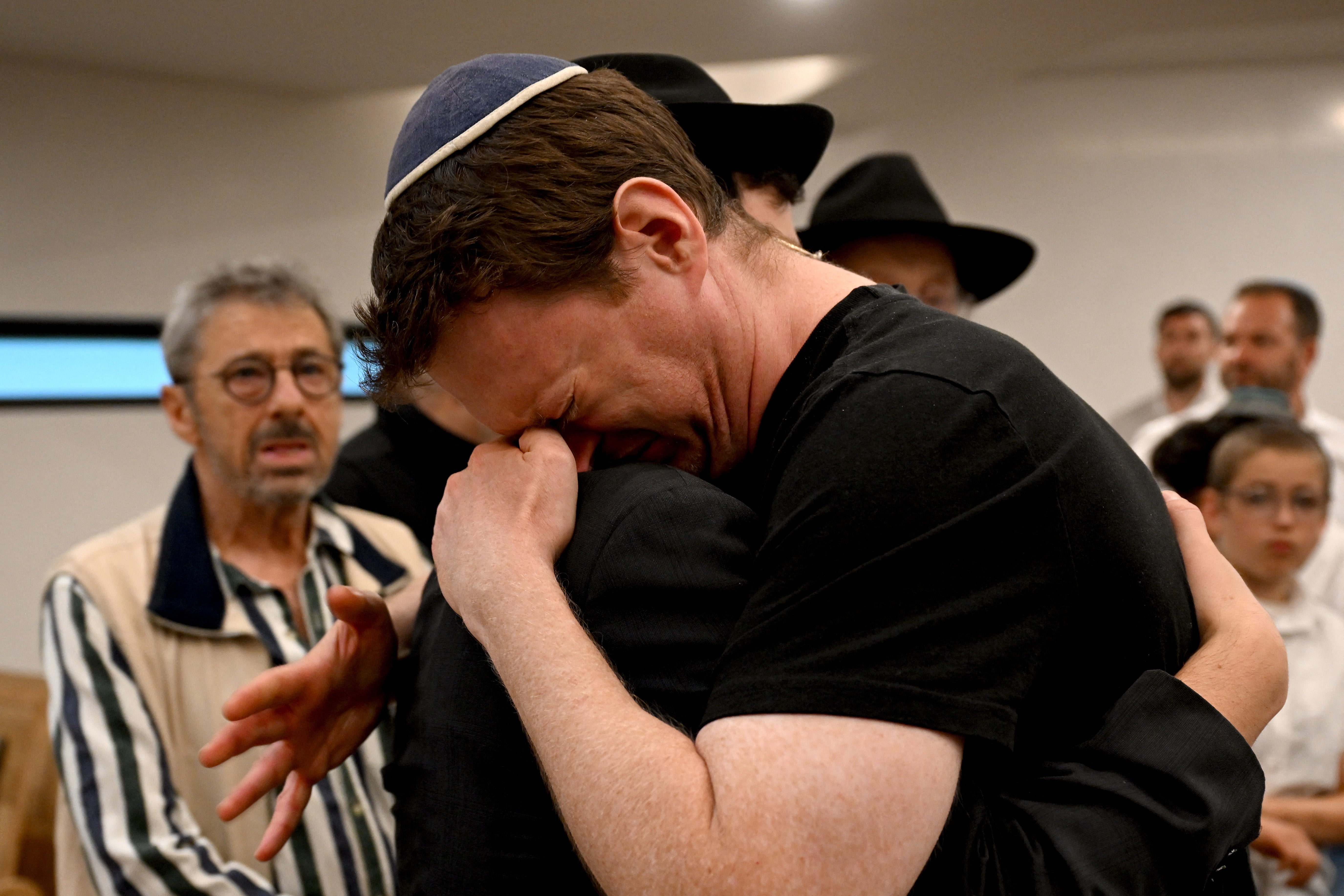 Members of the Jewish community mourn the victims who were killed in terror attacks in Bondi
