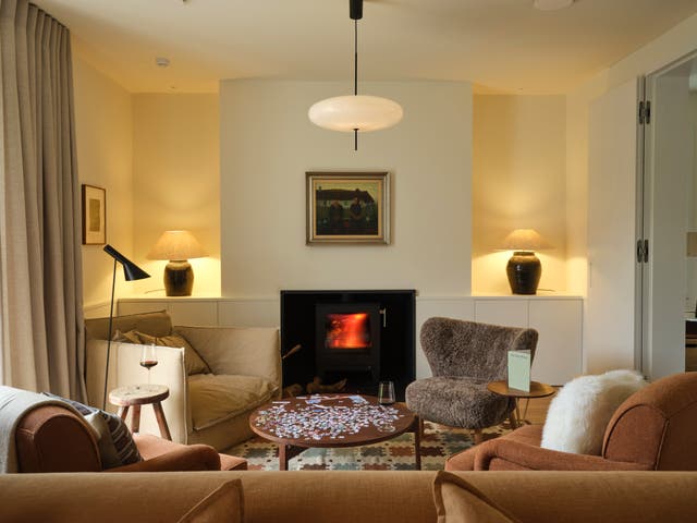 <p>Cosy up by the fire at this chic escape in Devon</p>